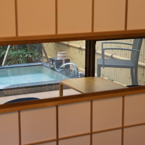 View of the open-air bath in the garden from the room