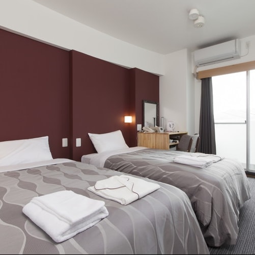 Twin: A twin room with a modern and calm atmosphere. Please take a rest.