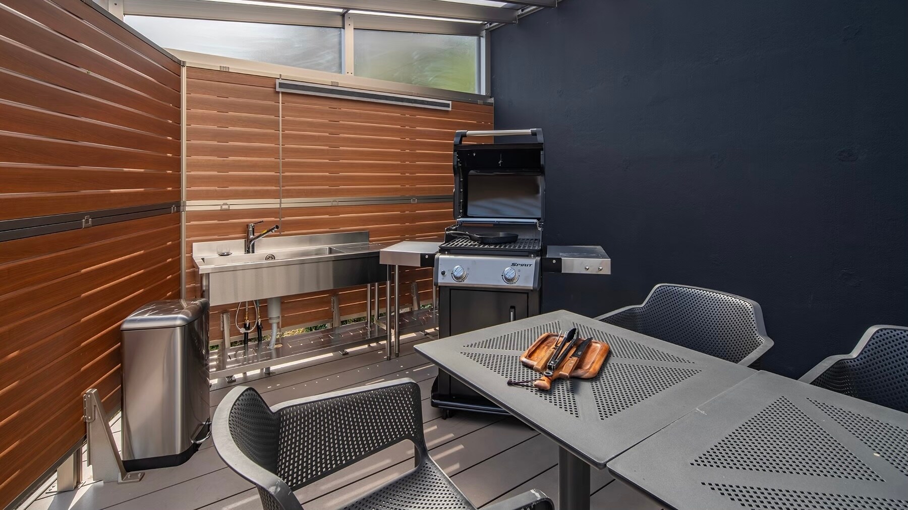 <BBQ space> We have a Weber gas grill that requires no fire starting and boasts powerful heat.
