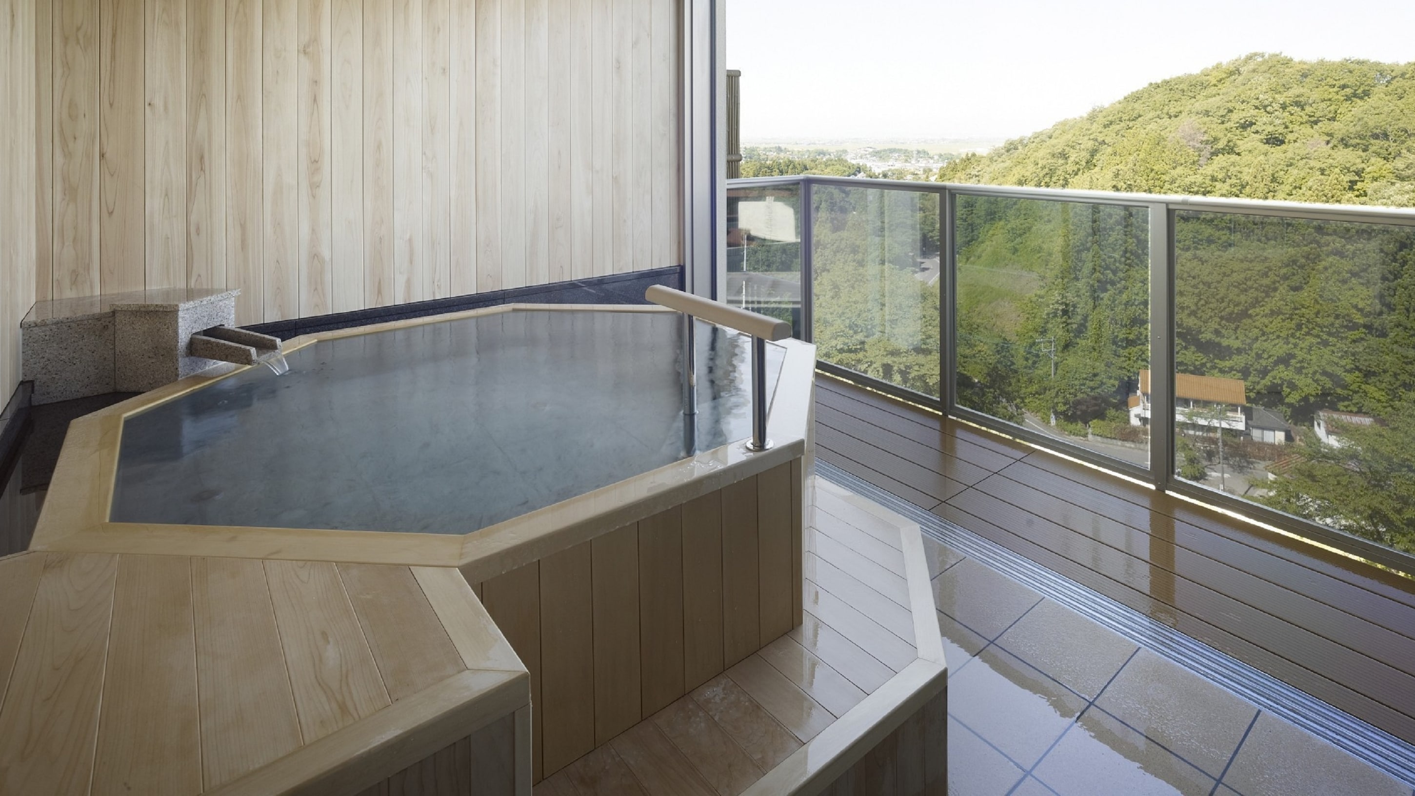 The private observation bath, Hyakuyu (fee required), offers a panoramic view of the Echigo Plain