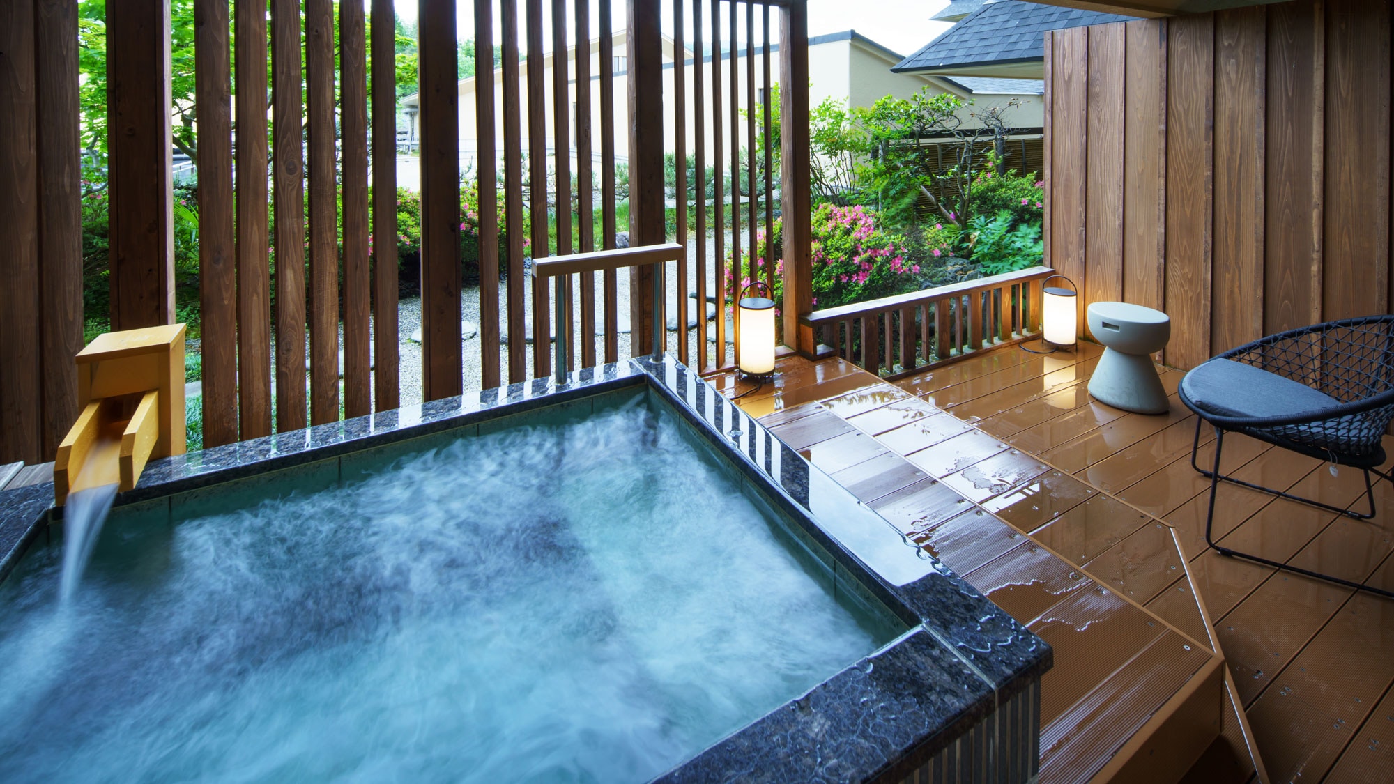 Modern Japanese style twin room with hammock and open-air bath