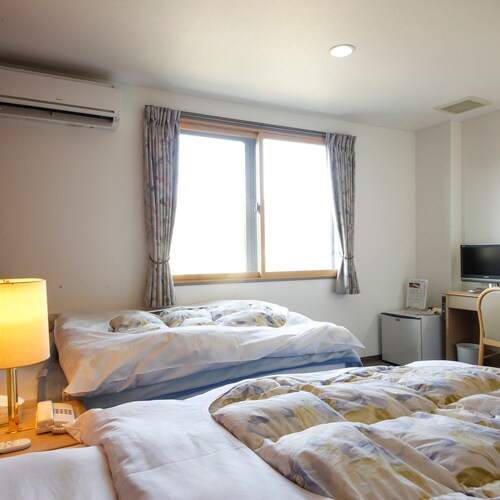 A Western-style twin room where two people can relax comfortably / Example