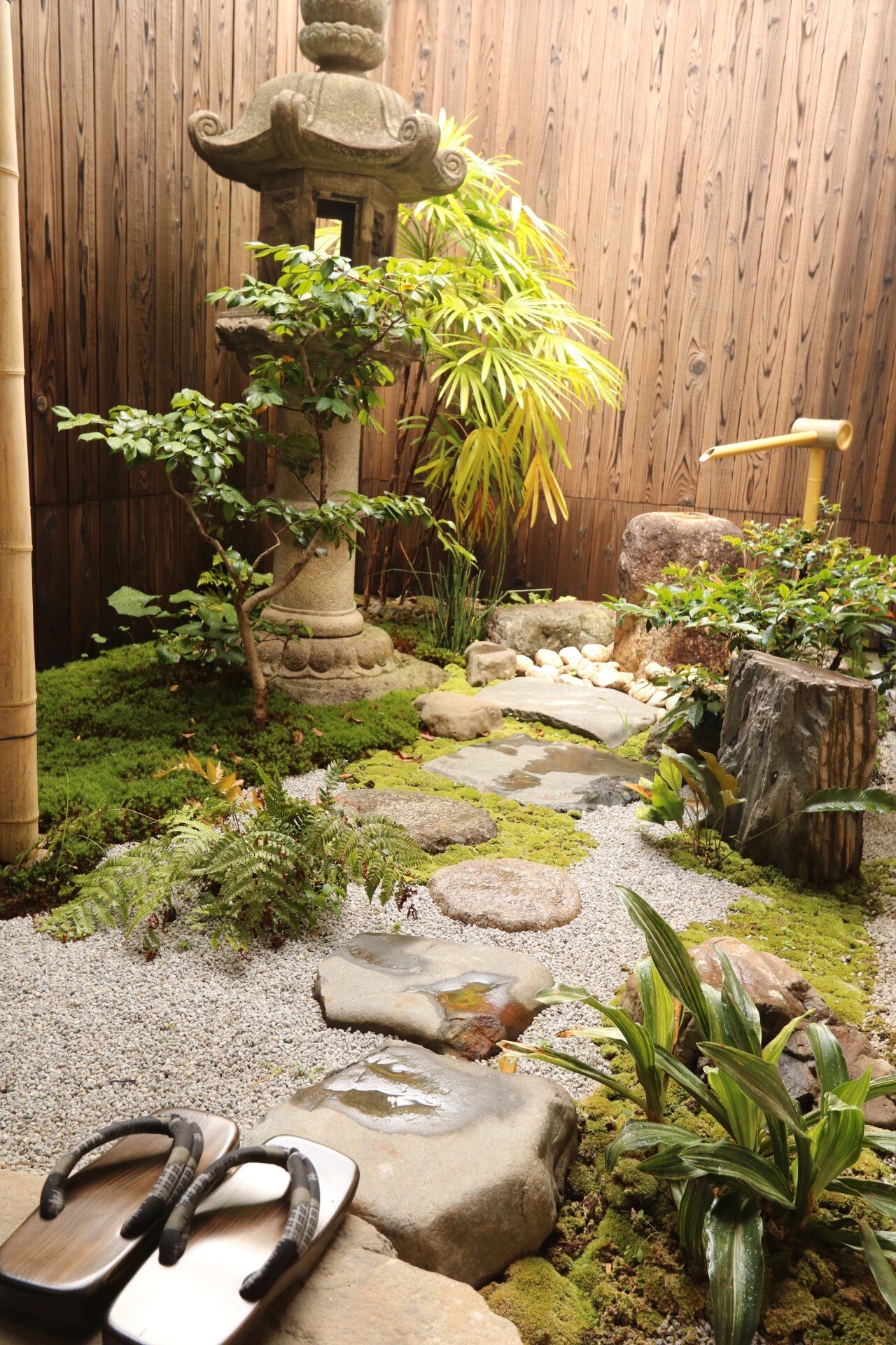 The garden seen from the porch is lit up at night