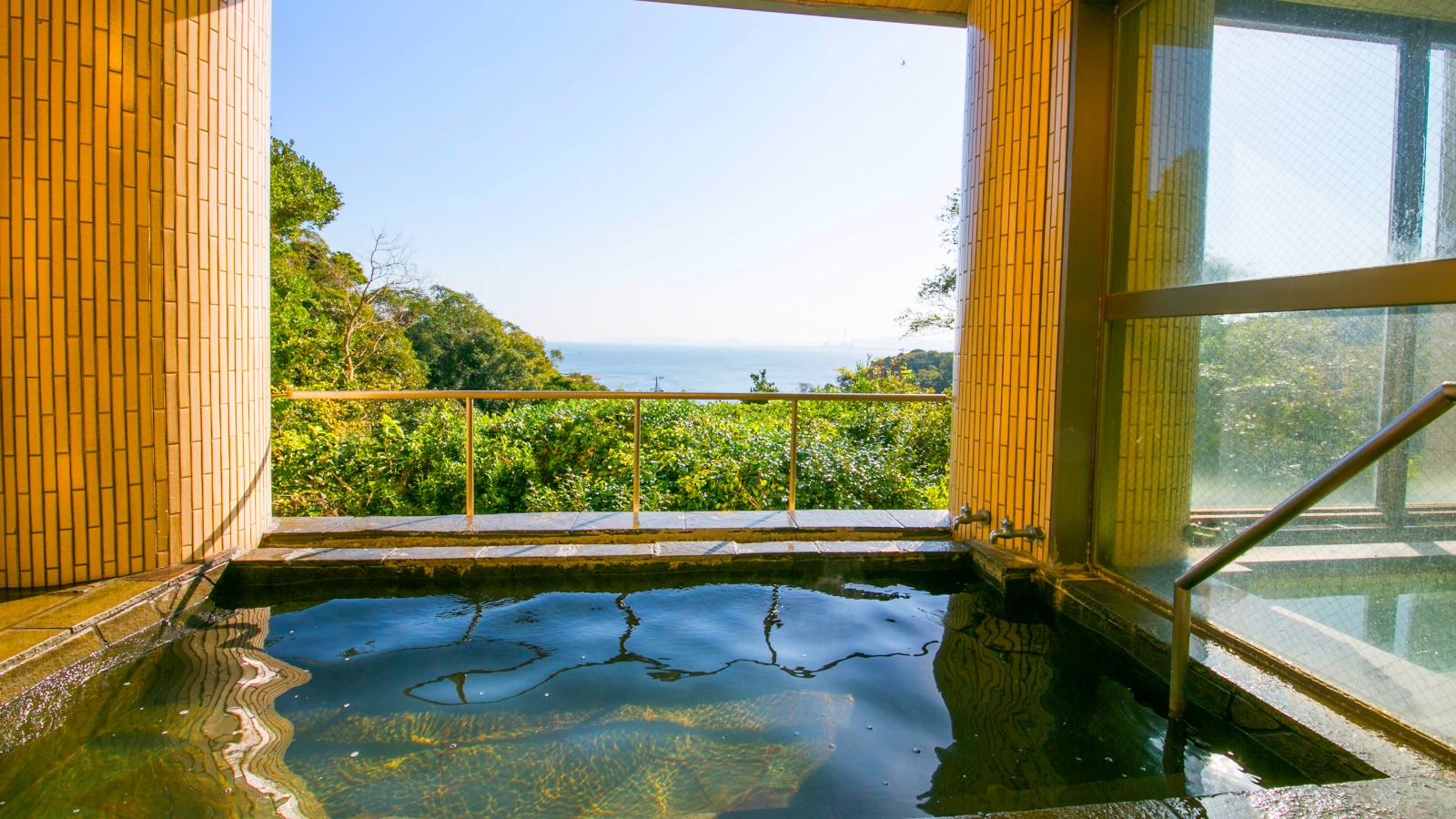 Open-air bath with ocean view overlooking Mikawa Bay