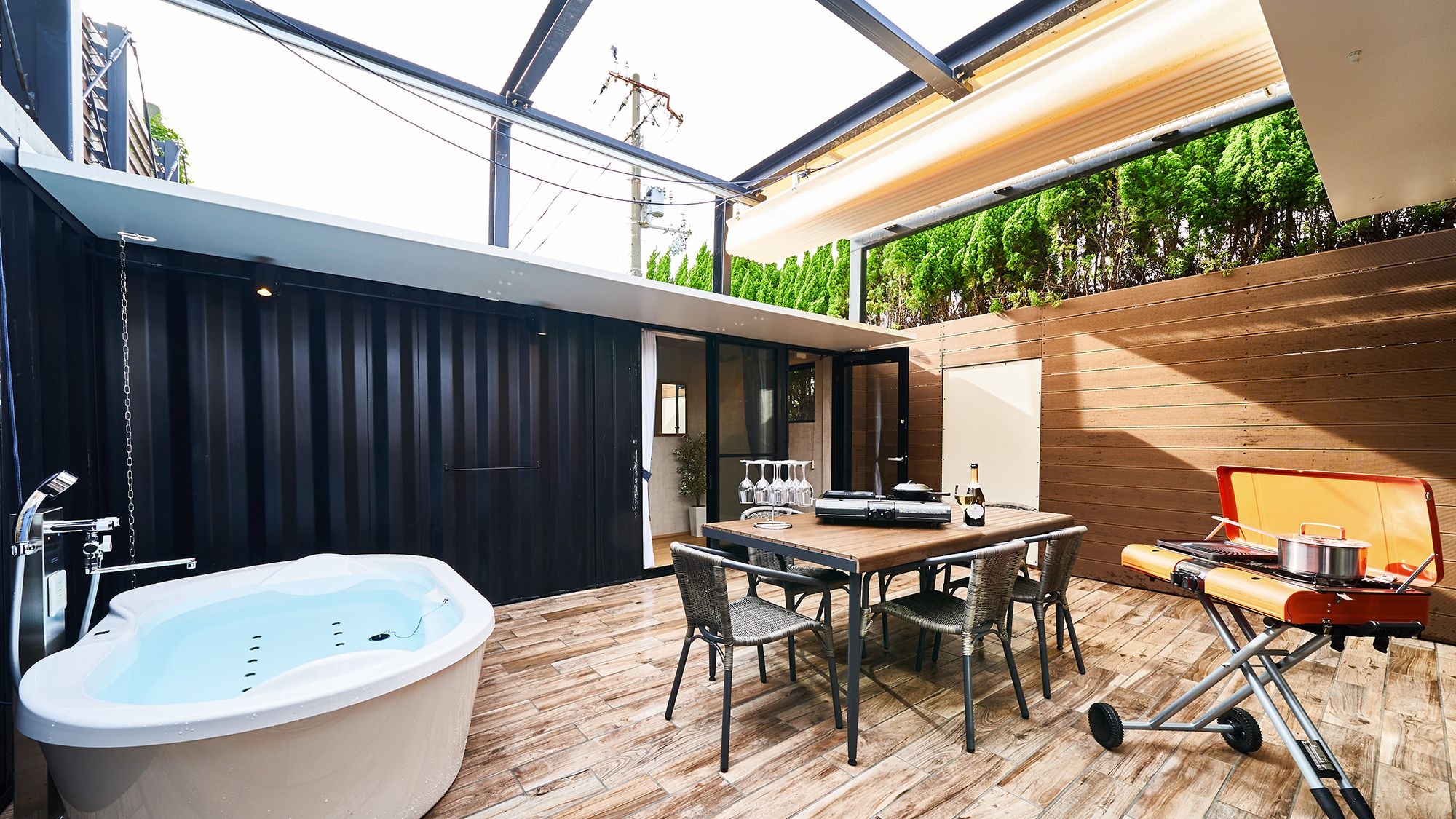 The terrace is equipped with a jacuzzi and BBQ grill.