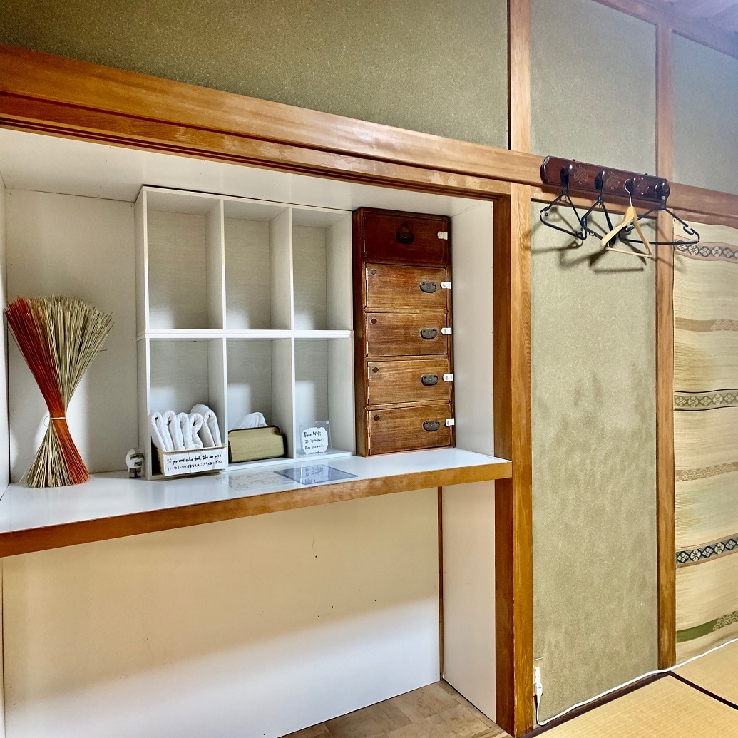 Dormitory rooms have storage boxes and safes.
