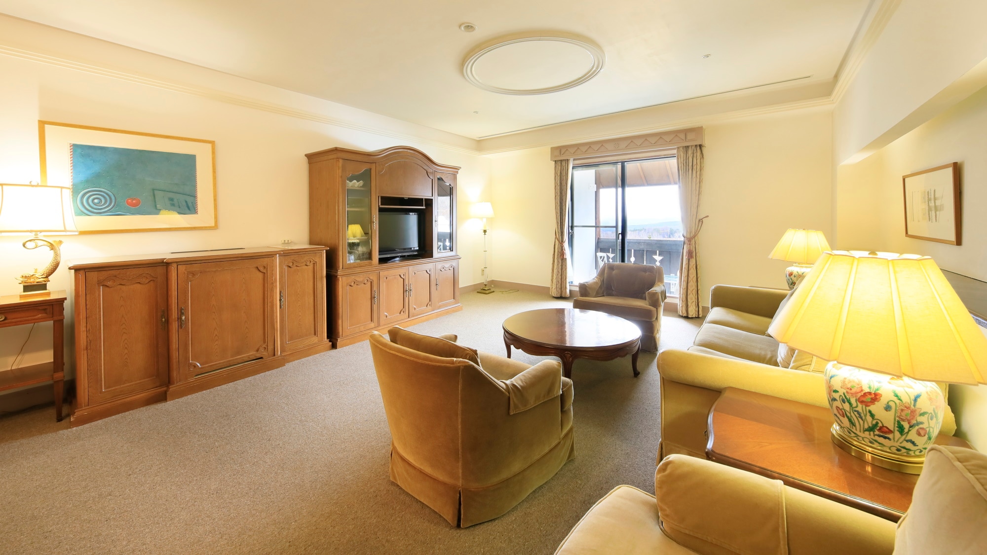 [Western-style Suite] Spacious living room equipped with a sofa and dining table