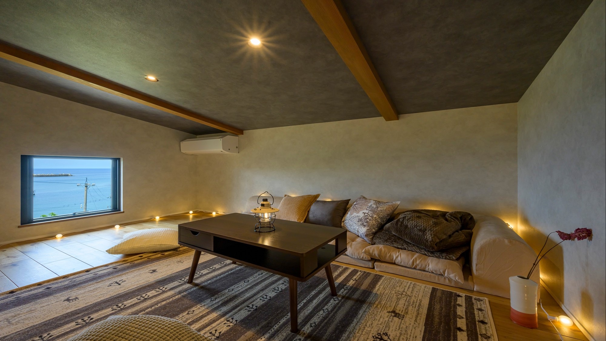 The loft is equipped with a low sofa for you to relax in.