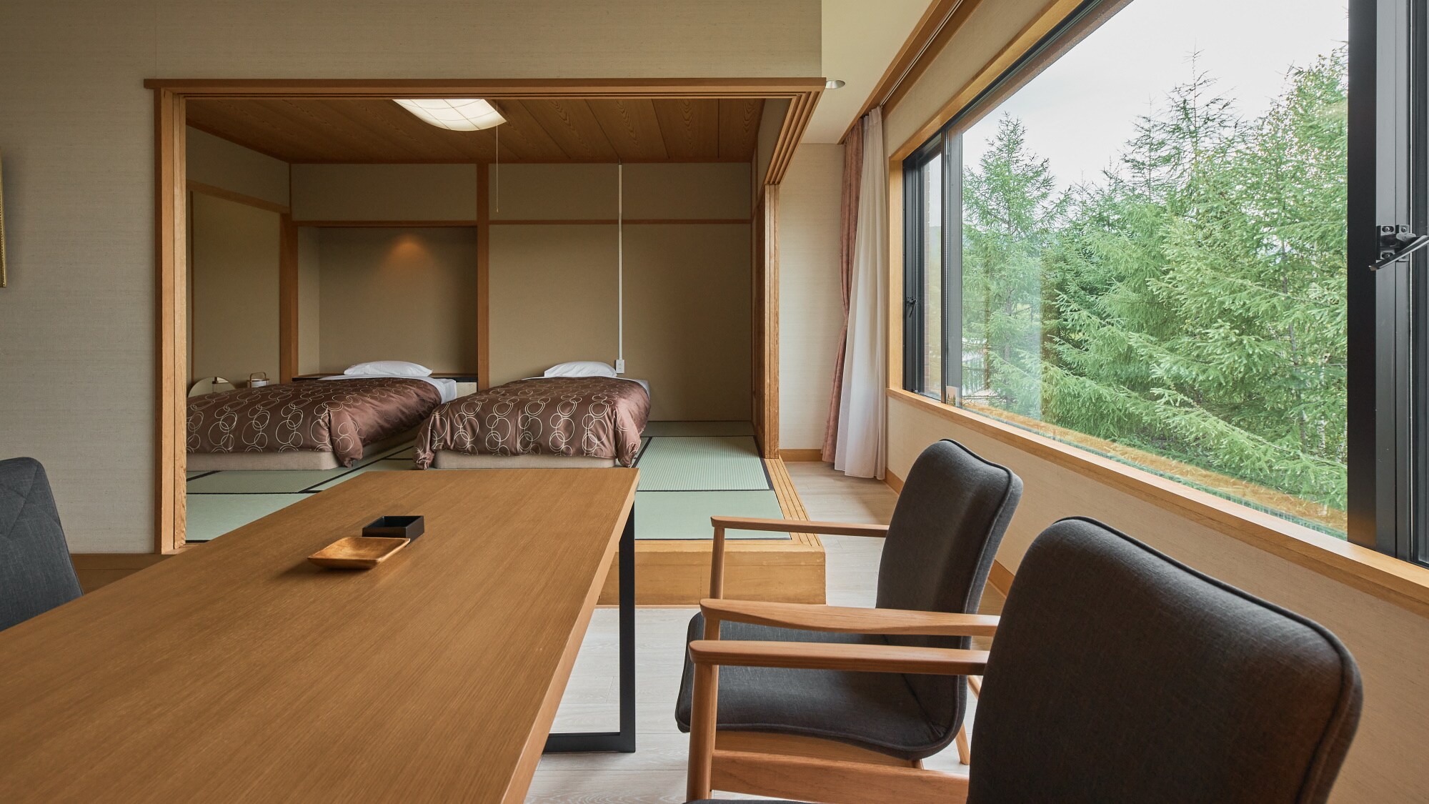 Standard room example | Two beds and two futons for a maximum of four guests.