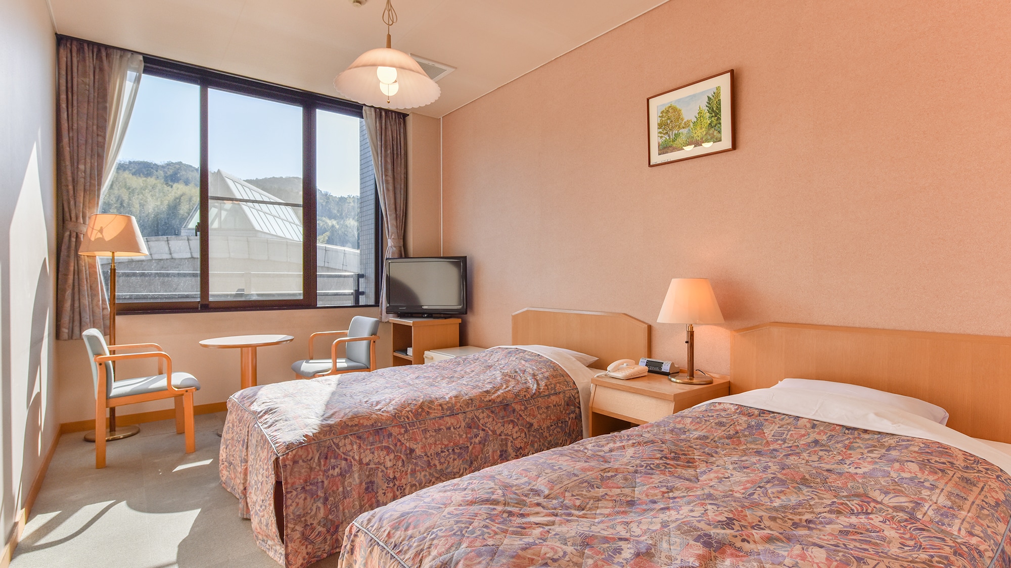 * [Example of guest room/Western-style twin room] A simple room with two single beds.
