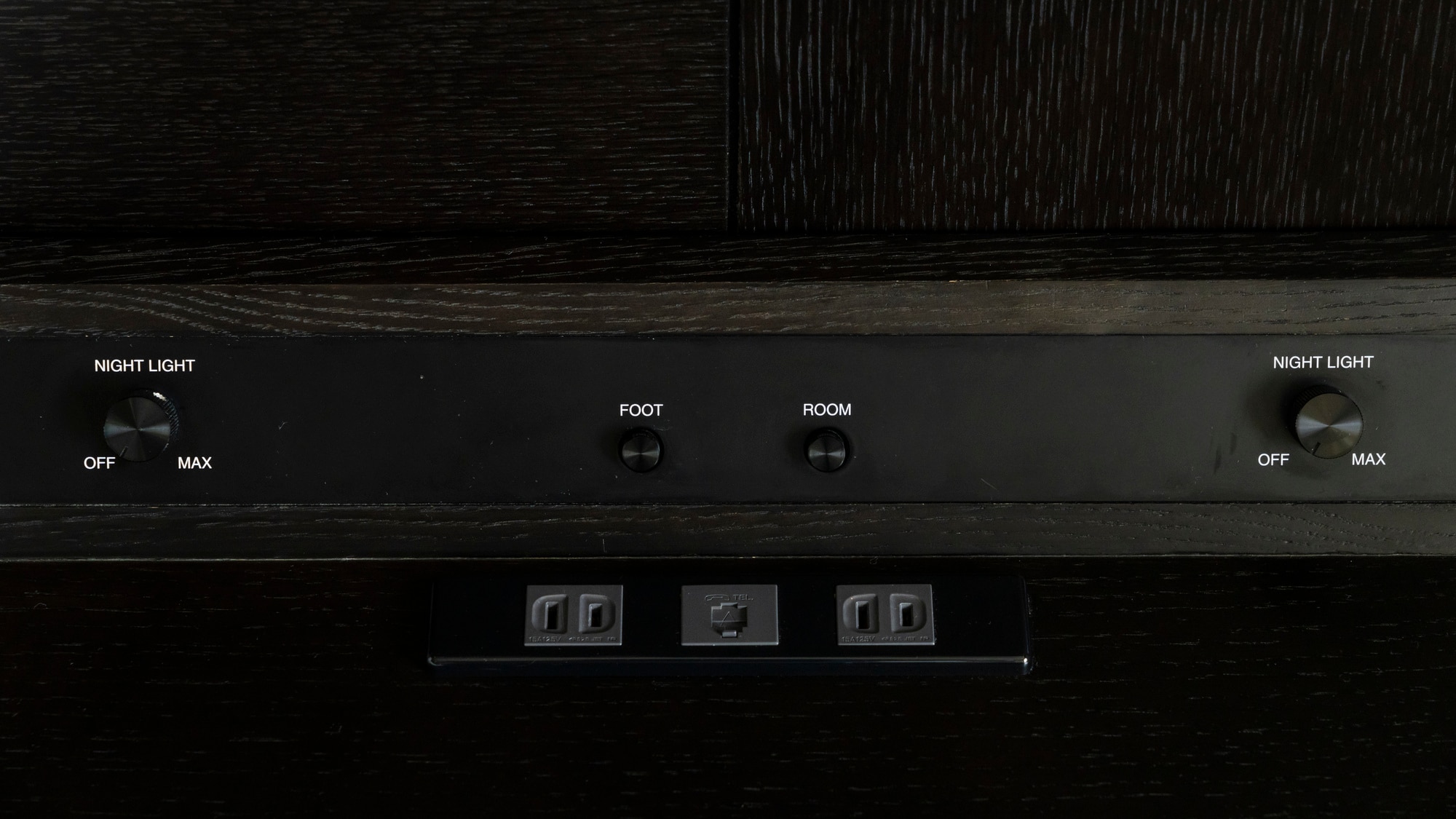 The bedside table is equipped with an outlet port (example)
