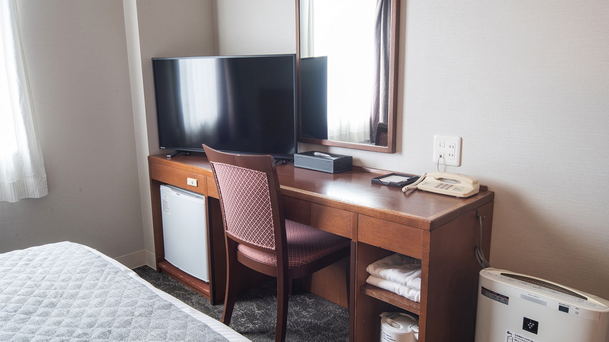 The spacious desk has a 40-inch TV!