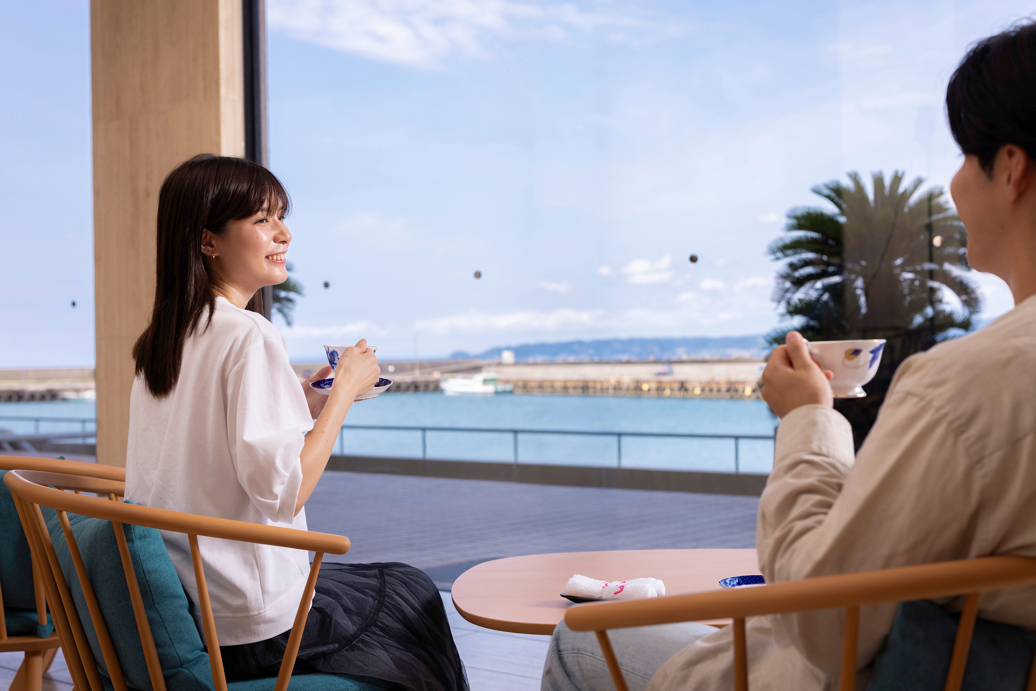 Relax in our lobby overlooking the sea with a drink in hand.