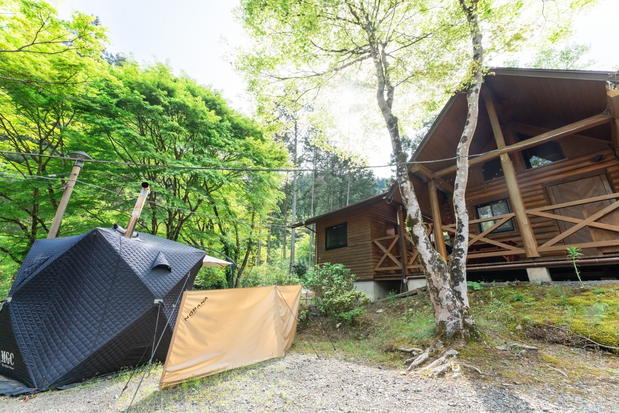 Log cabin with tent sauna