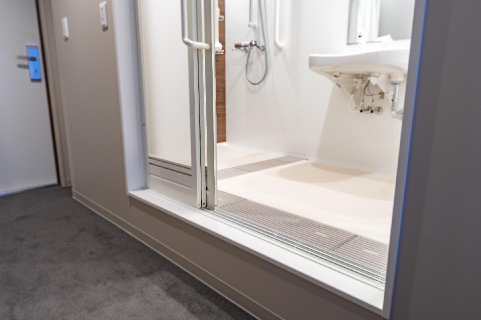 Shower and toilet entrance from the room side (twin room)