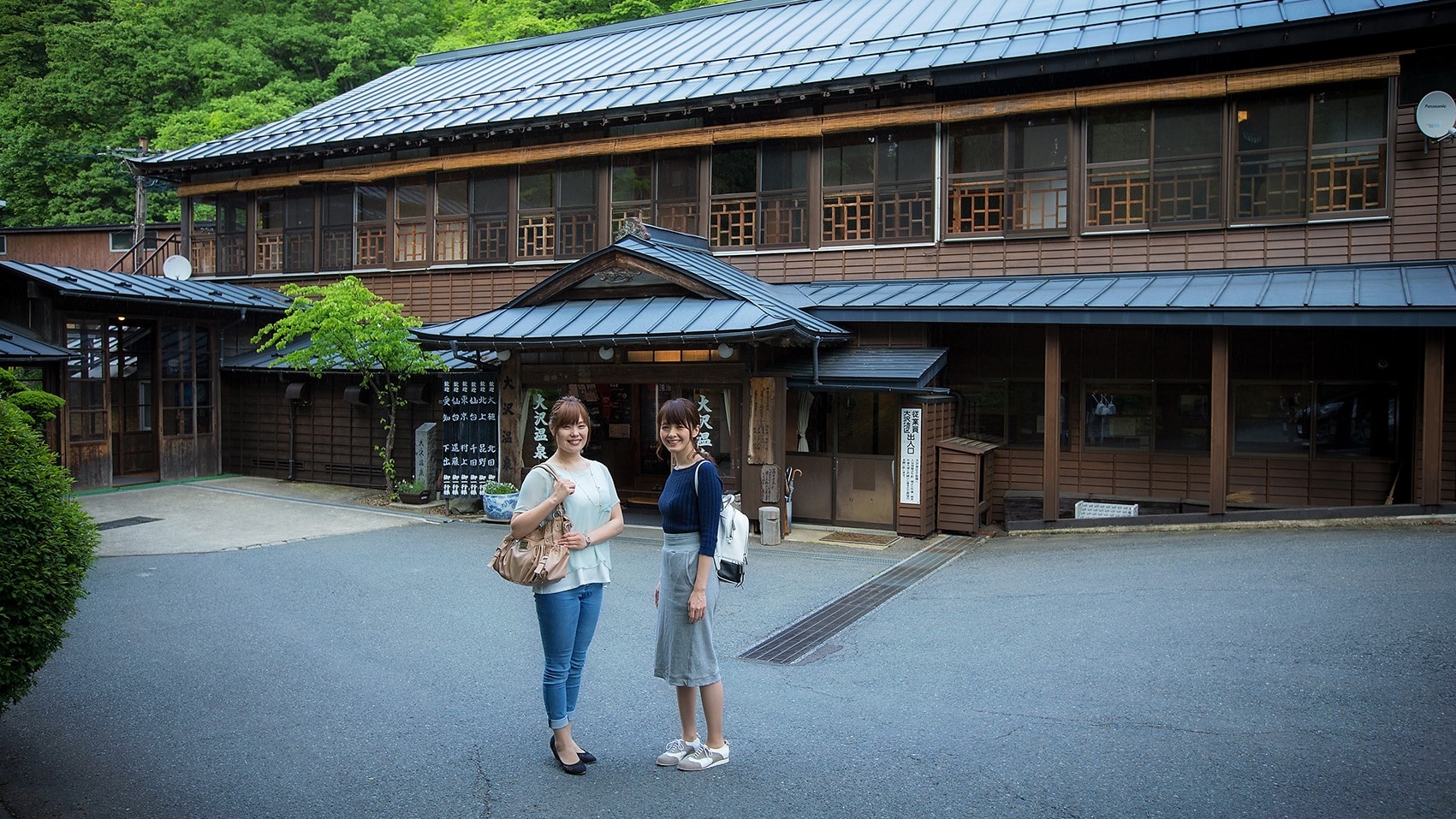 With a hot spring bathhouse in the background