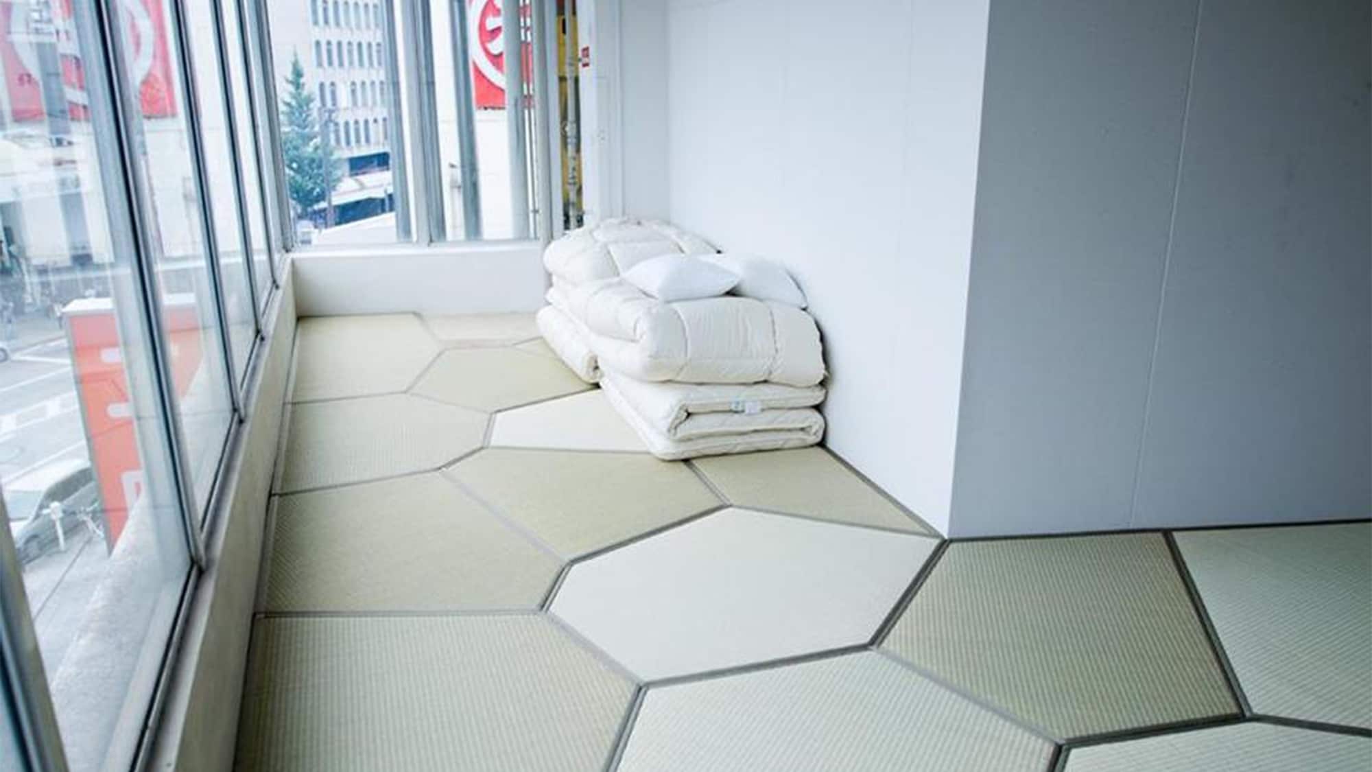・ Japanese-style room with geometrically patterned tatami mats