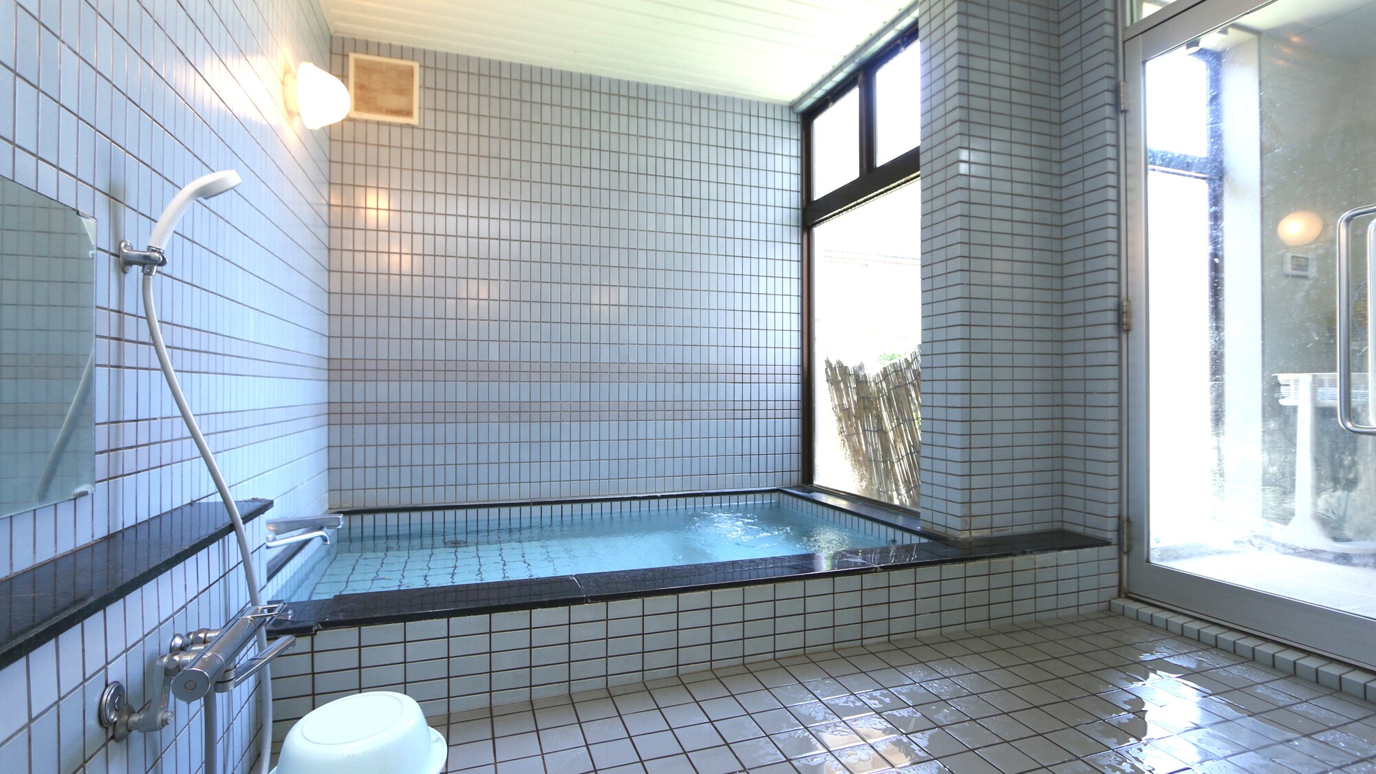 There is one bath for men and one for women.