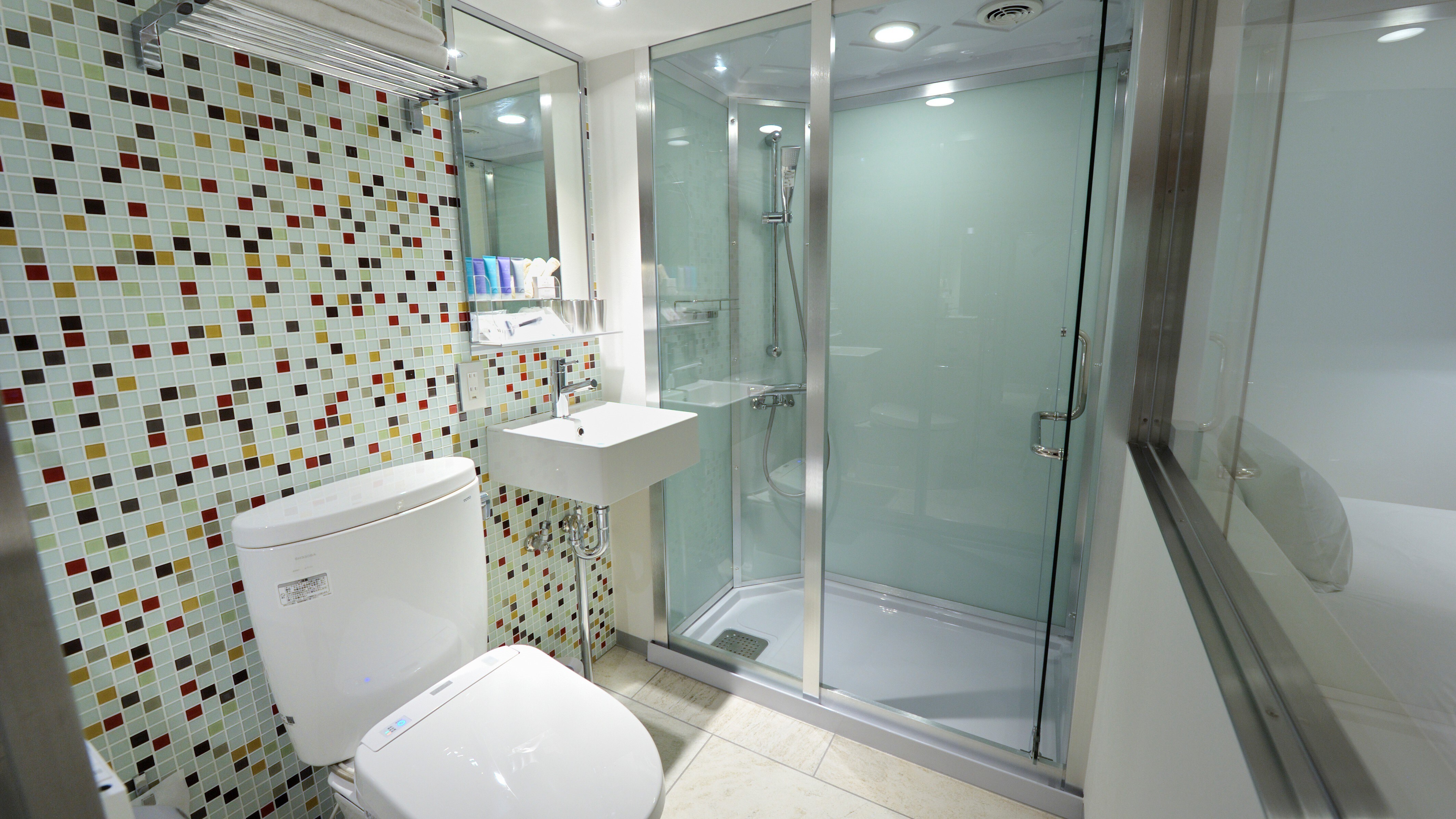 Glass-enclosed shower booth