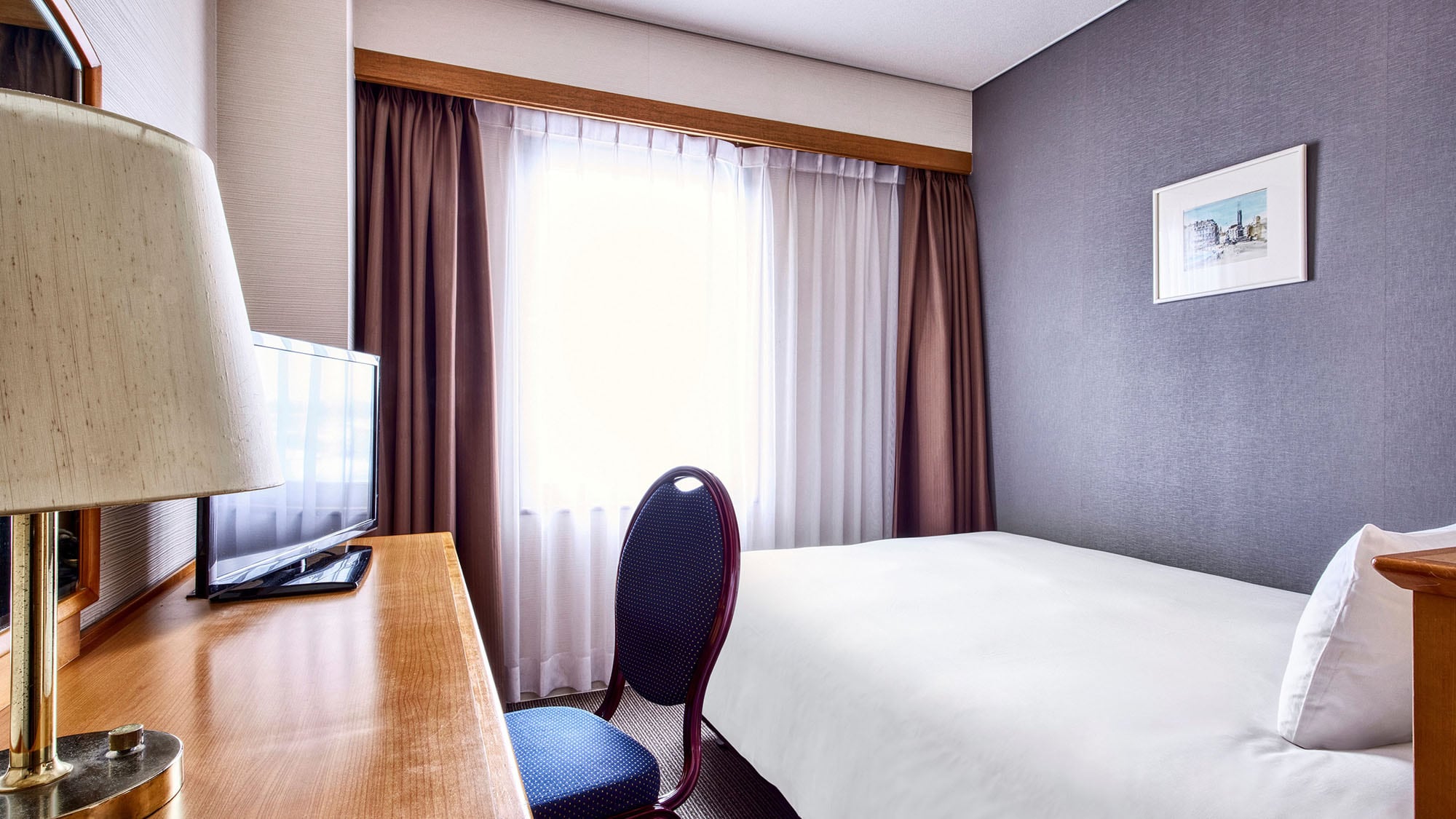 There is a desk where you can spread out your computer, making it suitable for business use. | Standard Double