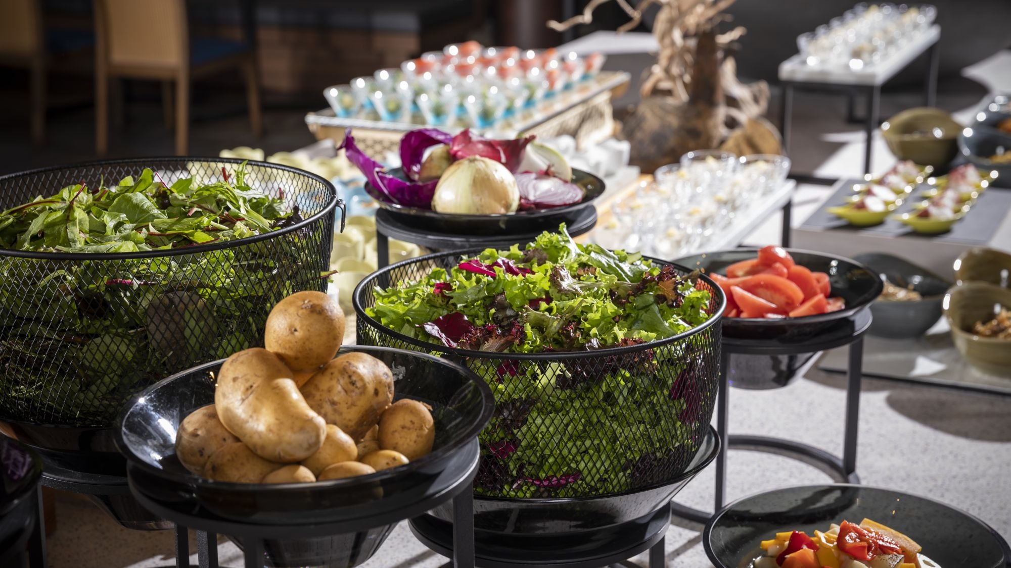 Breakfast buffet with raw, boiled, and grilled vegetables