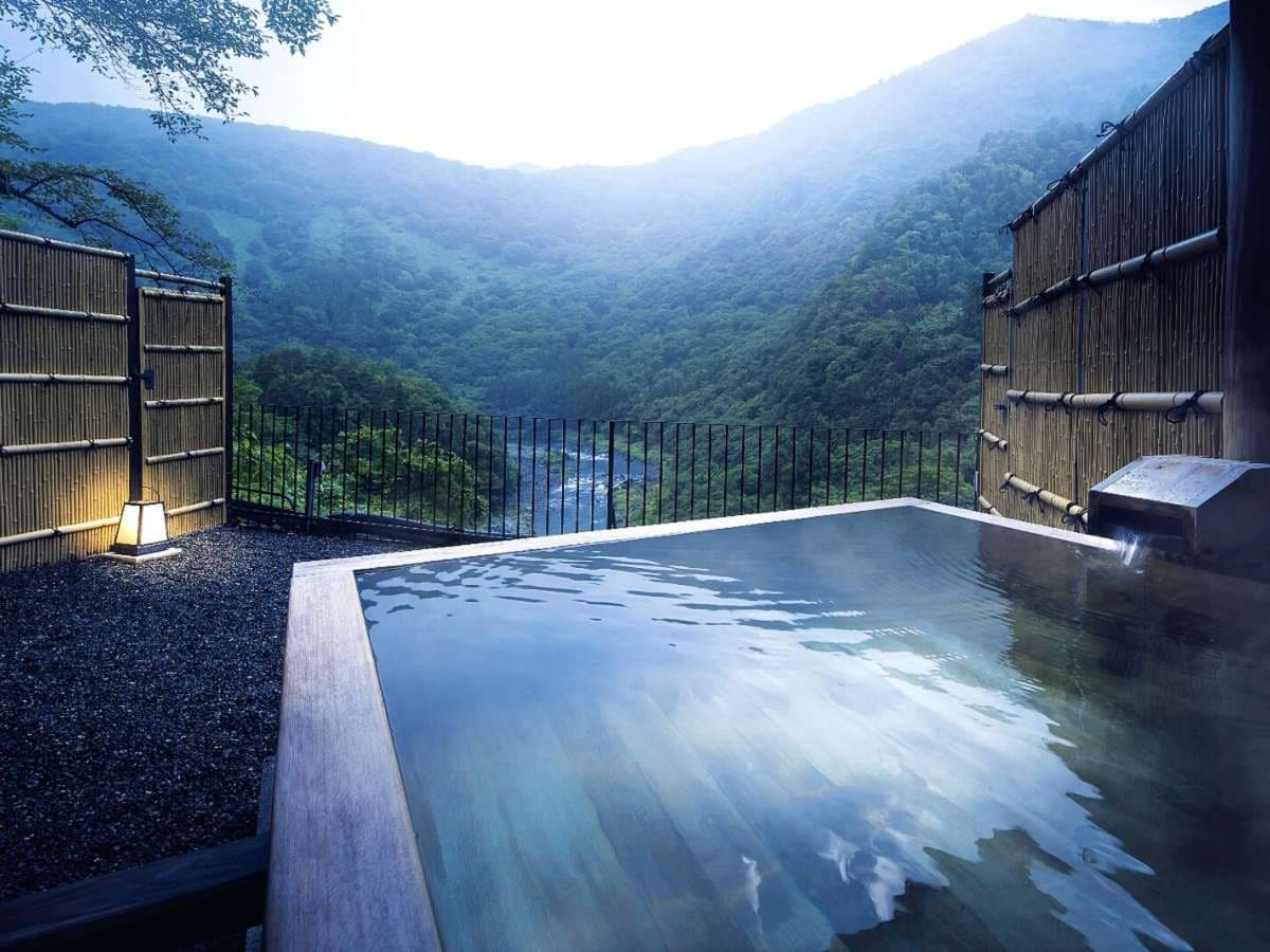 Room with open-air bath overlooking the valley