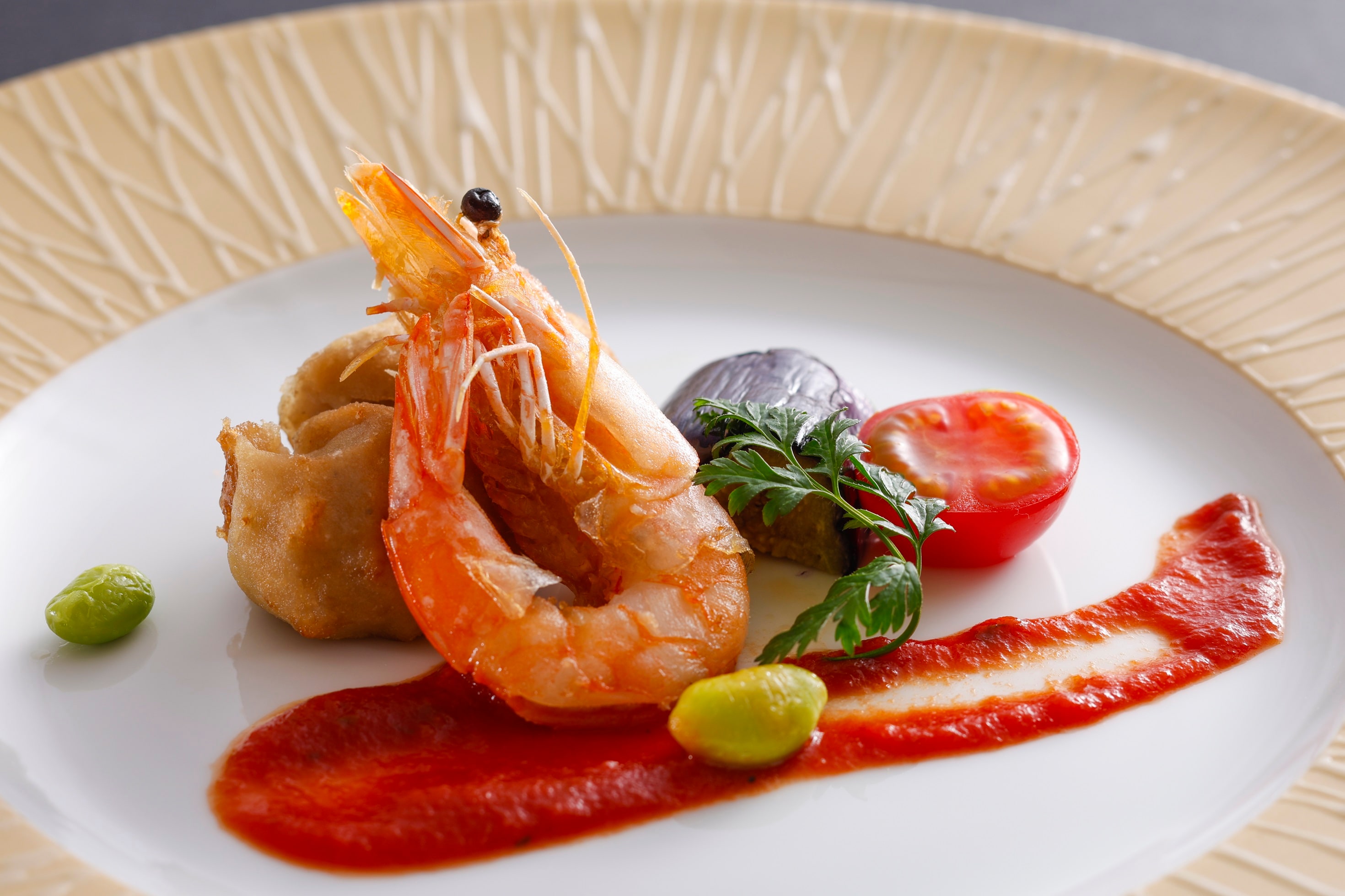 Example of a seasonal kaiseki meal for summer 2026 (Fried lotus root dumplings and shrimp with tomato sauce)
