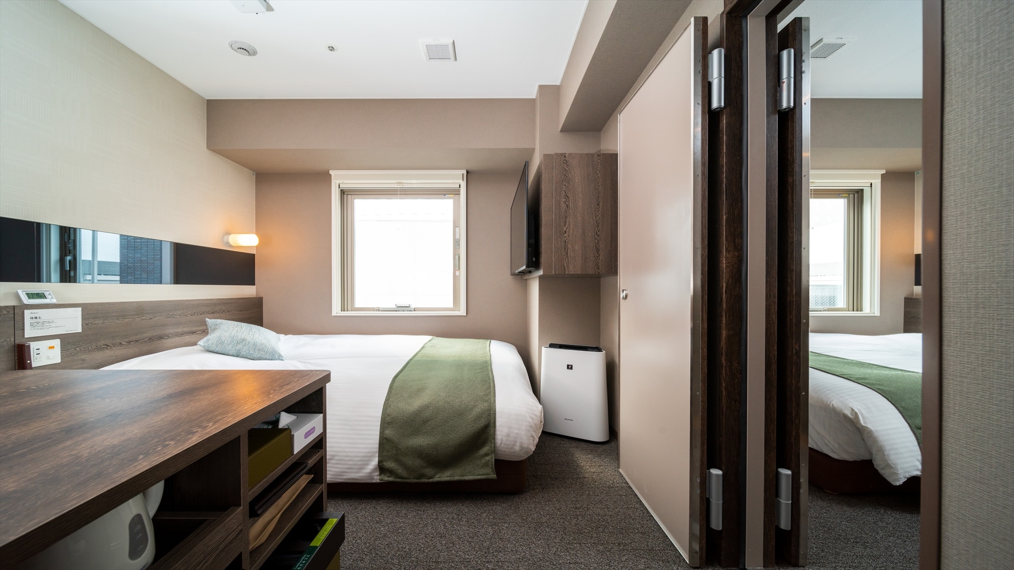 This room has two rooms with a door between them.