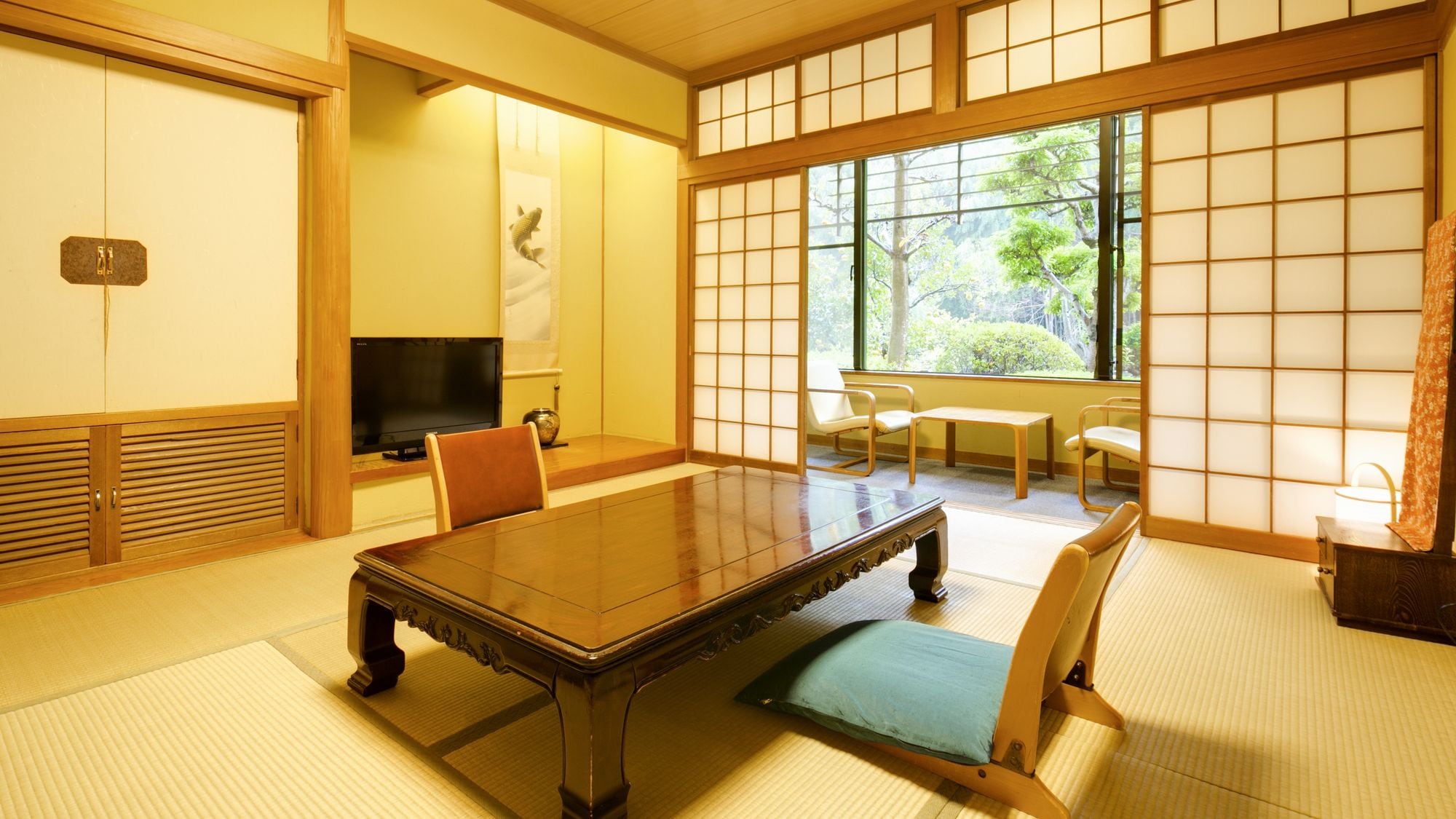 A spacious Japanese-style room with a veranda