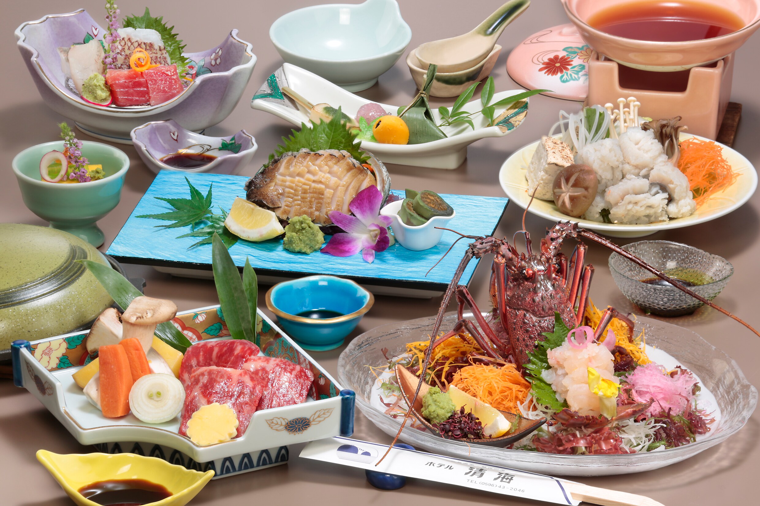 Lobster sashimi, Matsusaka beef teppanyaki, and abalone sashimi