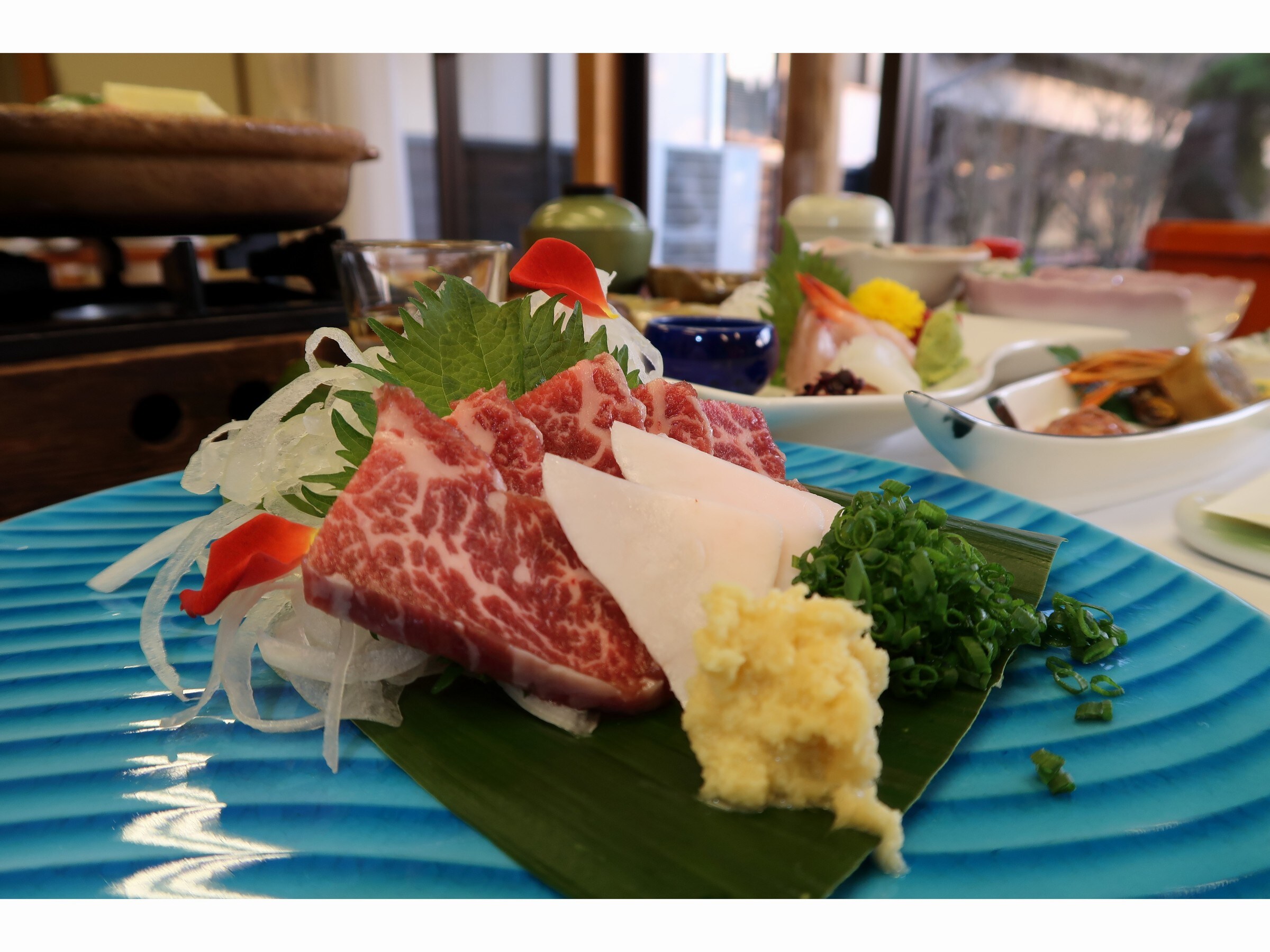 A luxurious dinner with horse sashimi