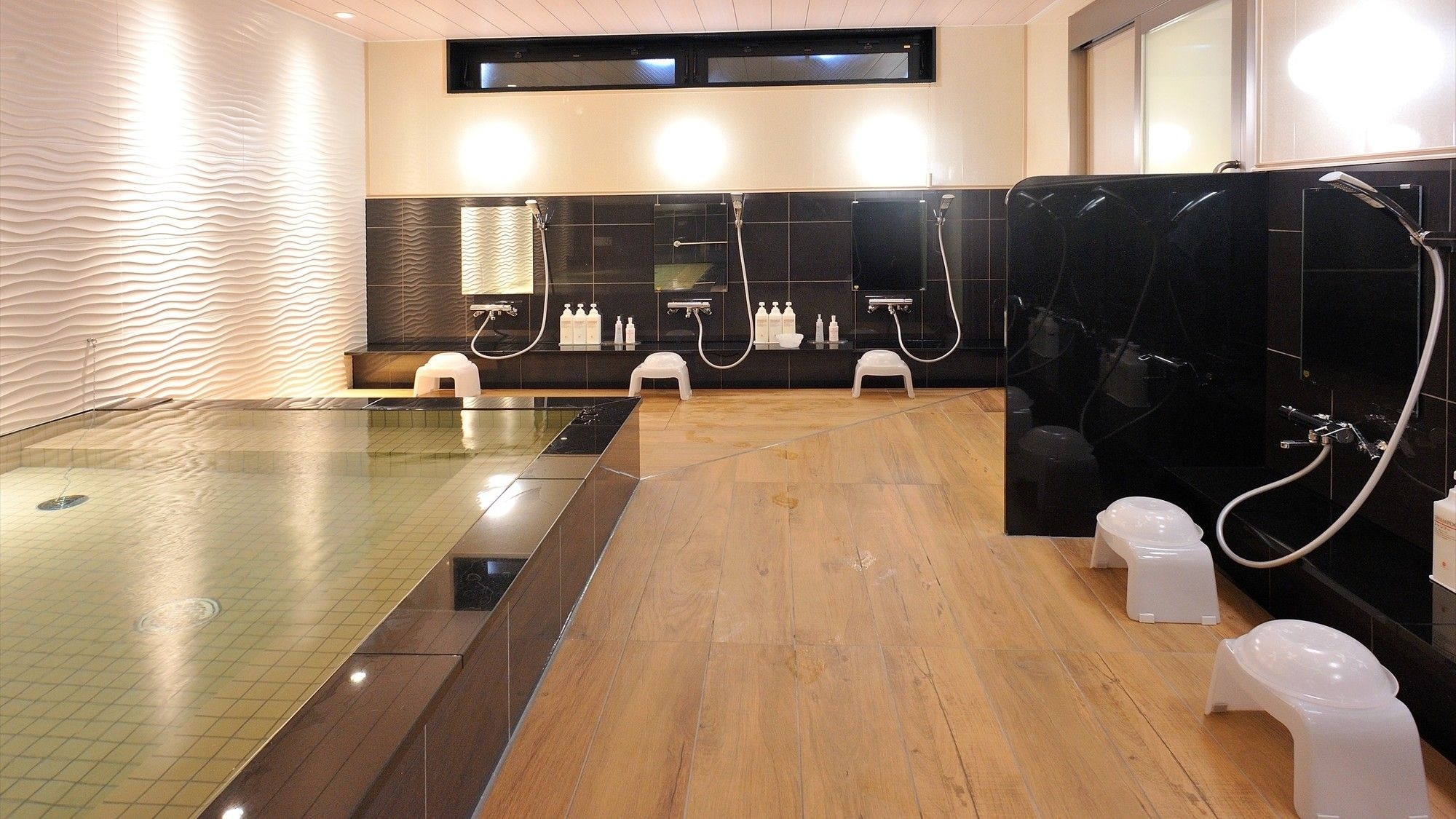 Women's college bath open, large bathtub and washroom