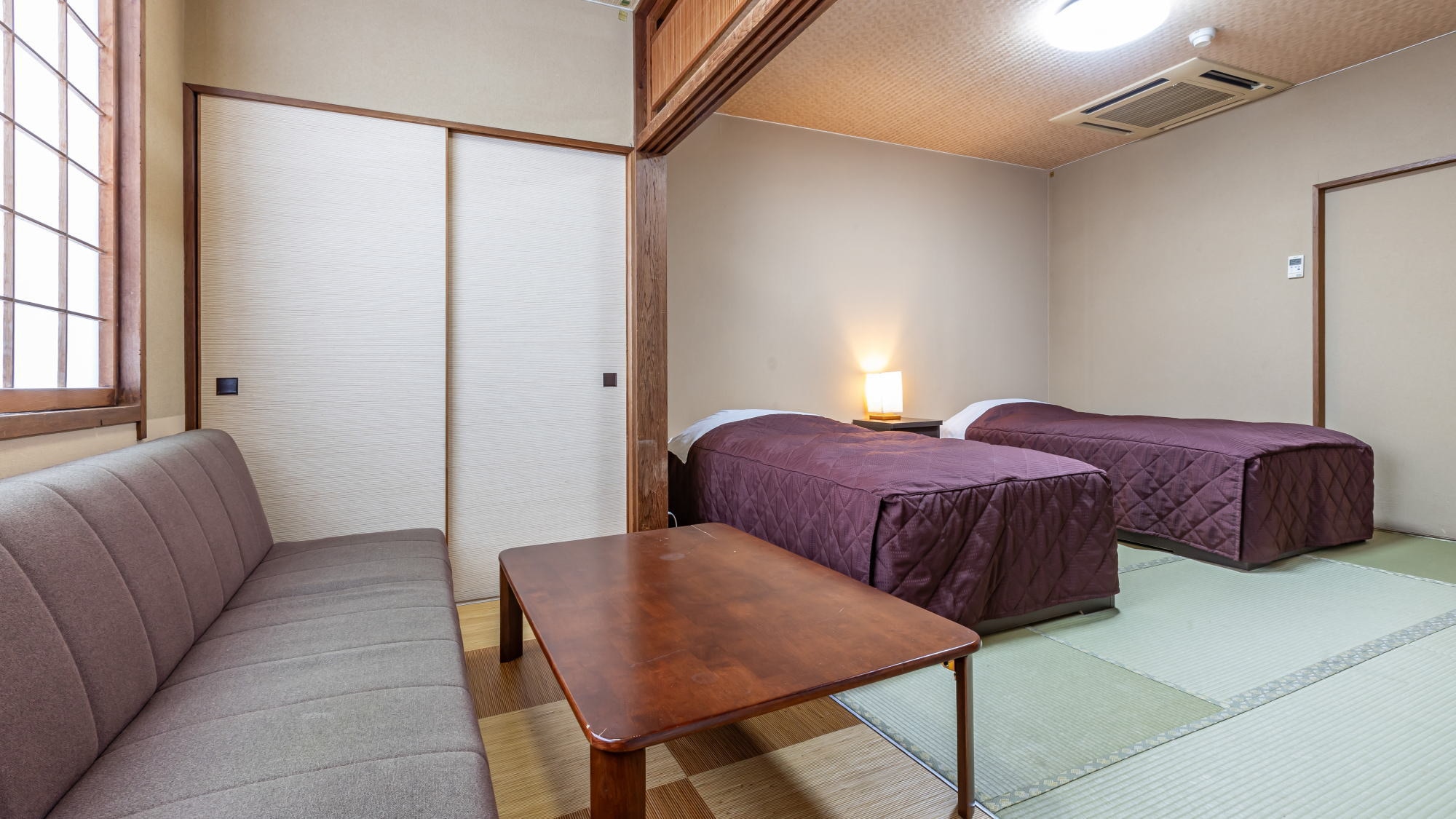 [East Wing Japanese Twin] This is a Japanese-style room with a bed.
