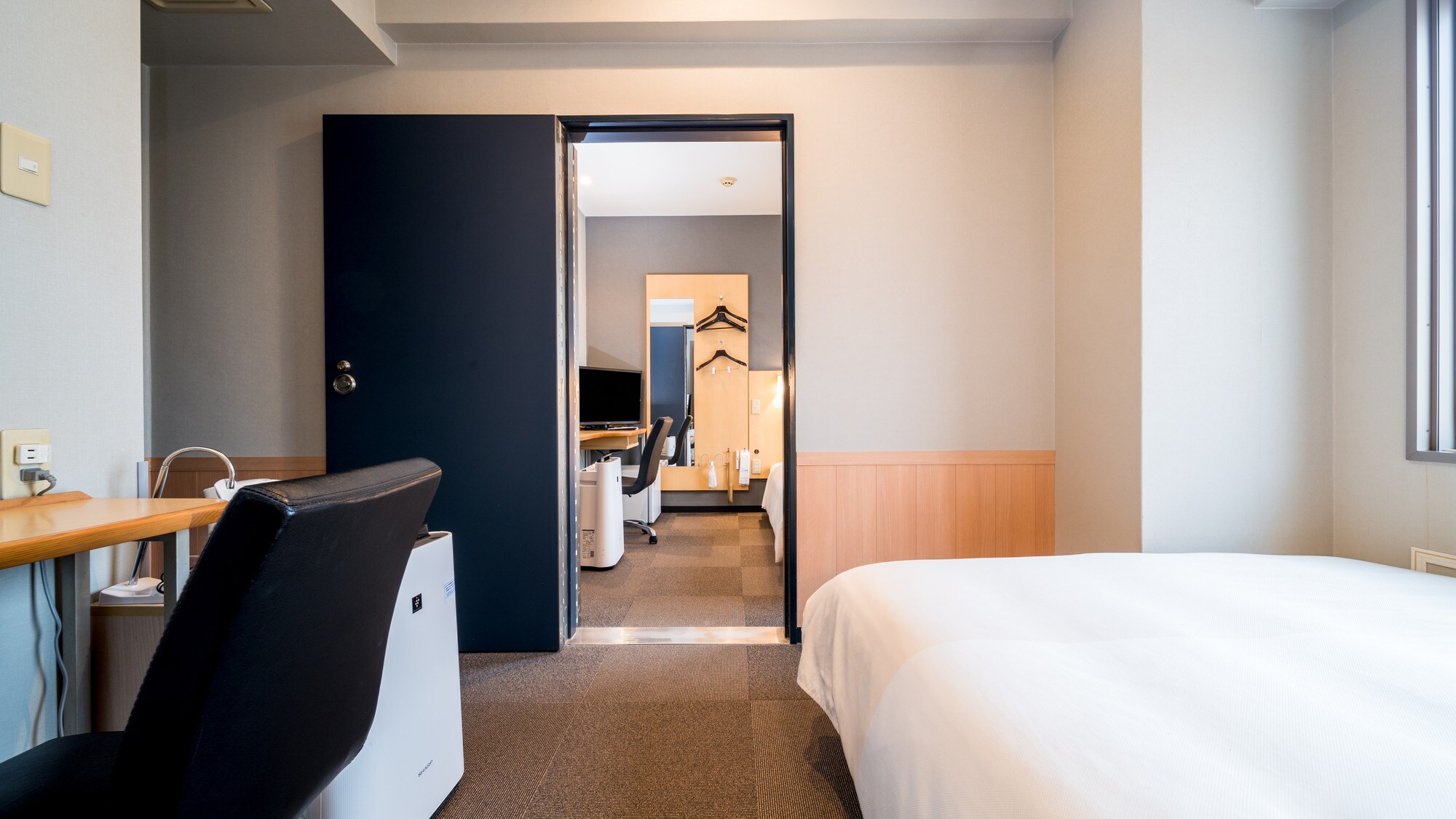 This room has two rooms with a door between them.