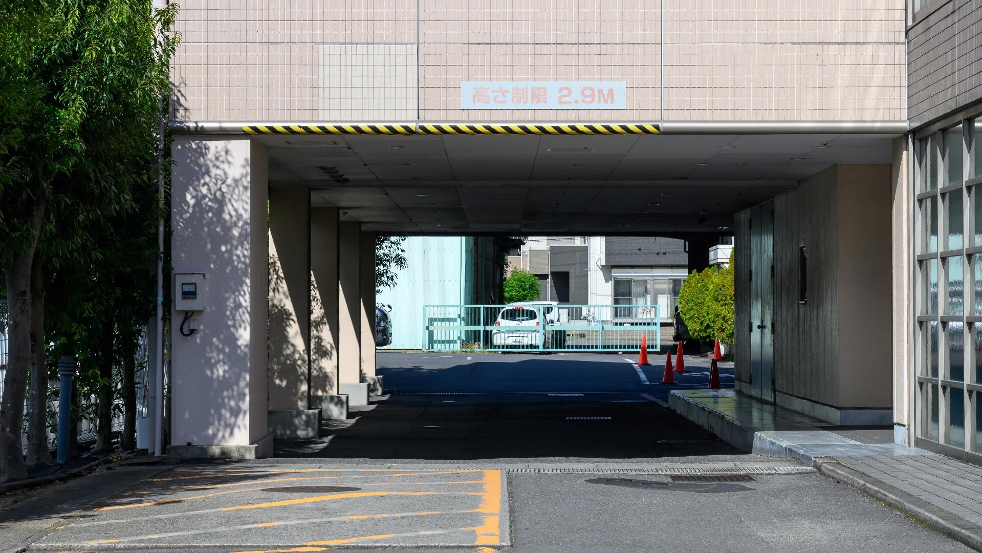 [Parking lot entrance]