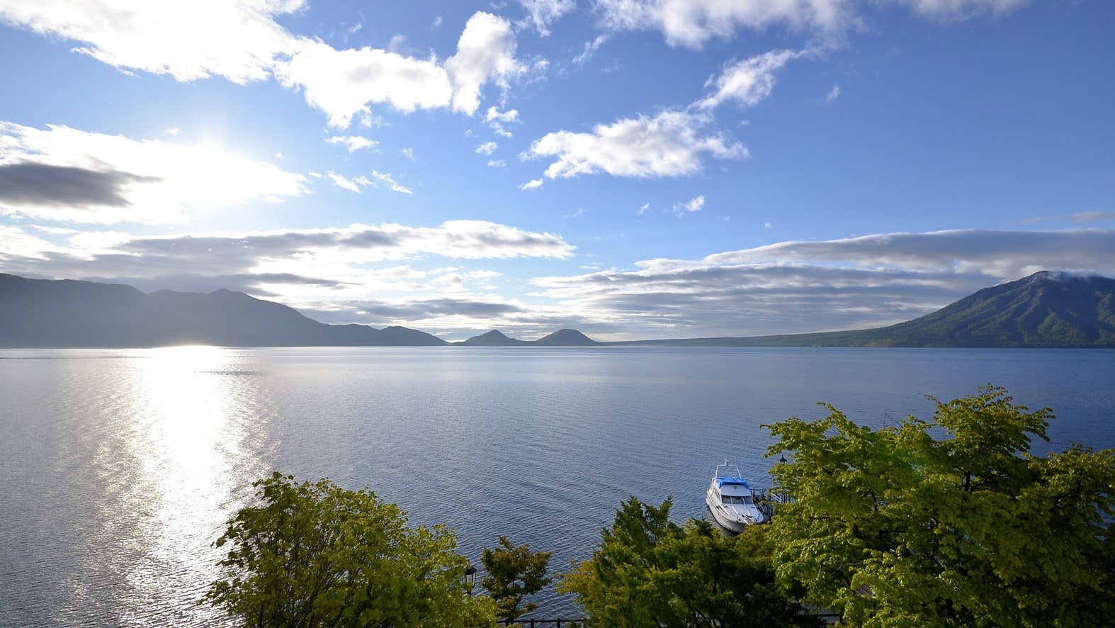 Enjoy the magnificent view of the wide blue sky and the lake