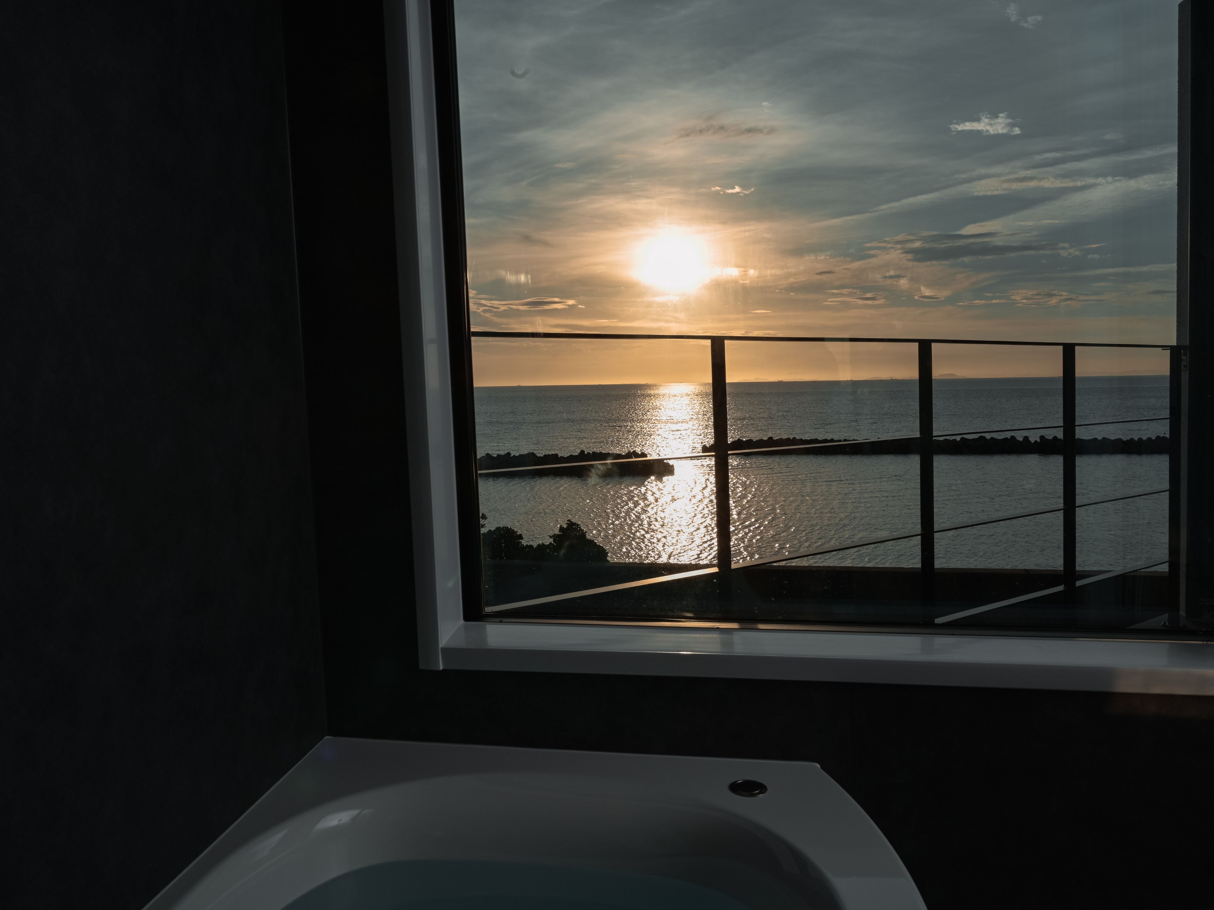 Bathing while watching the sun set over the ocean