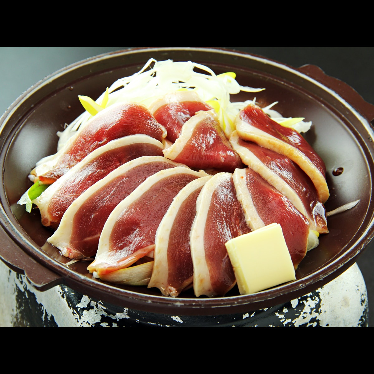Enjoy the rich flavor and tender meat of black tea duck on a porcelain china plate