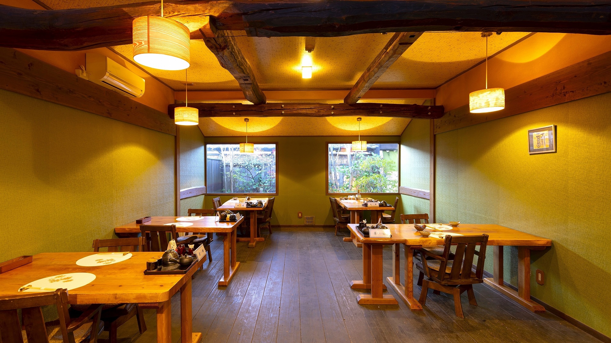 A restaurant with beautiful sunlight filtering through the trees