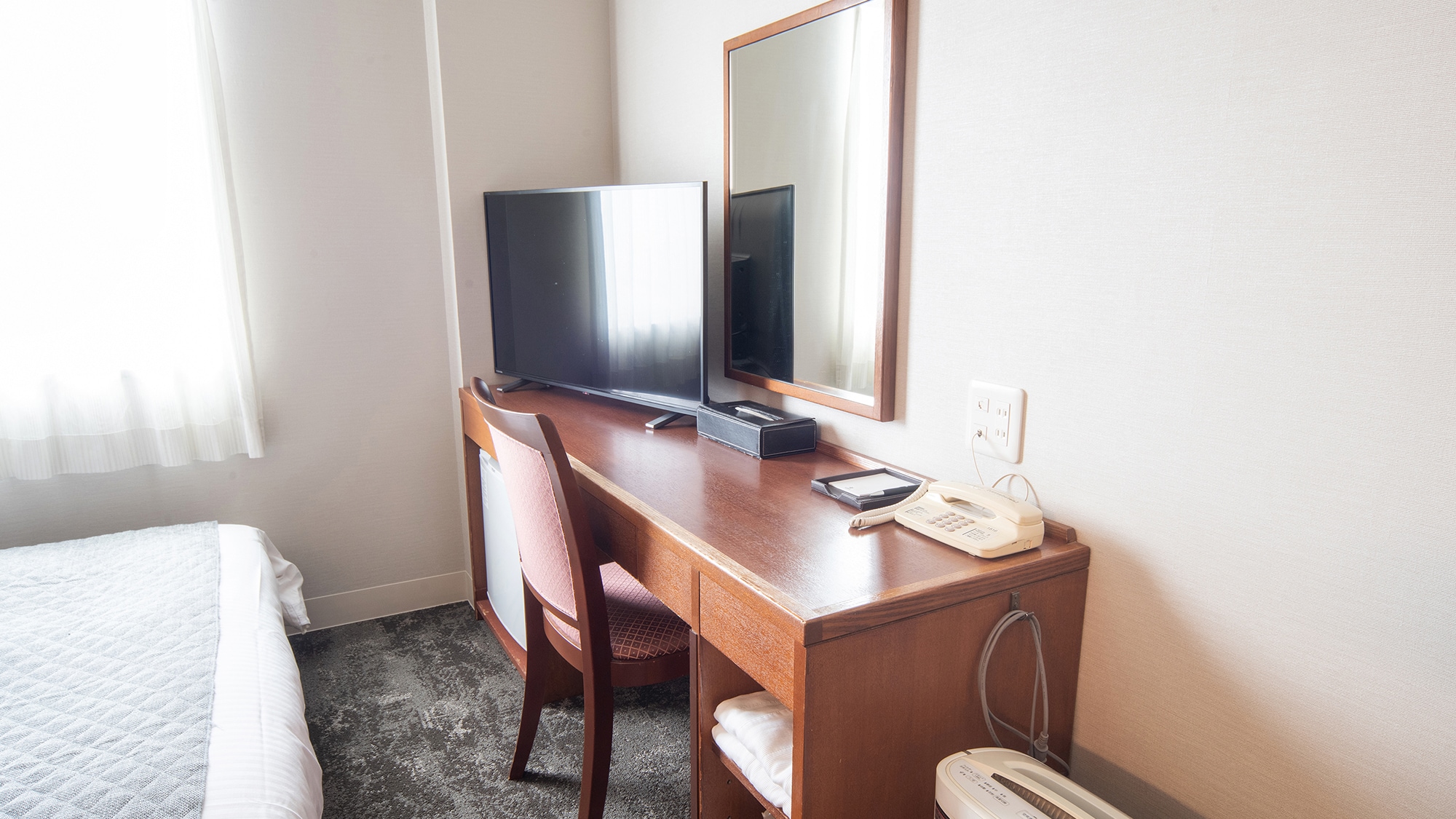 The spacious desk has a 40-inch TV!