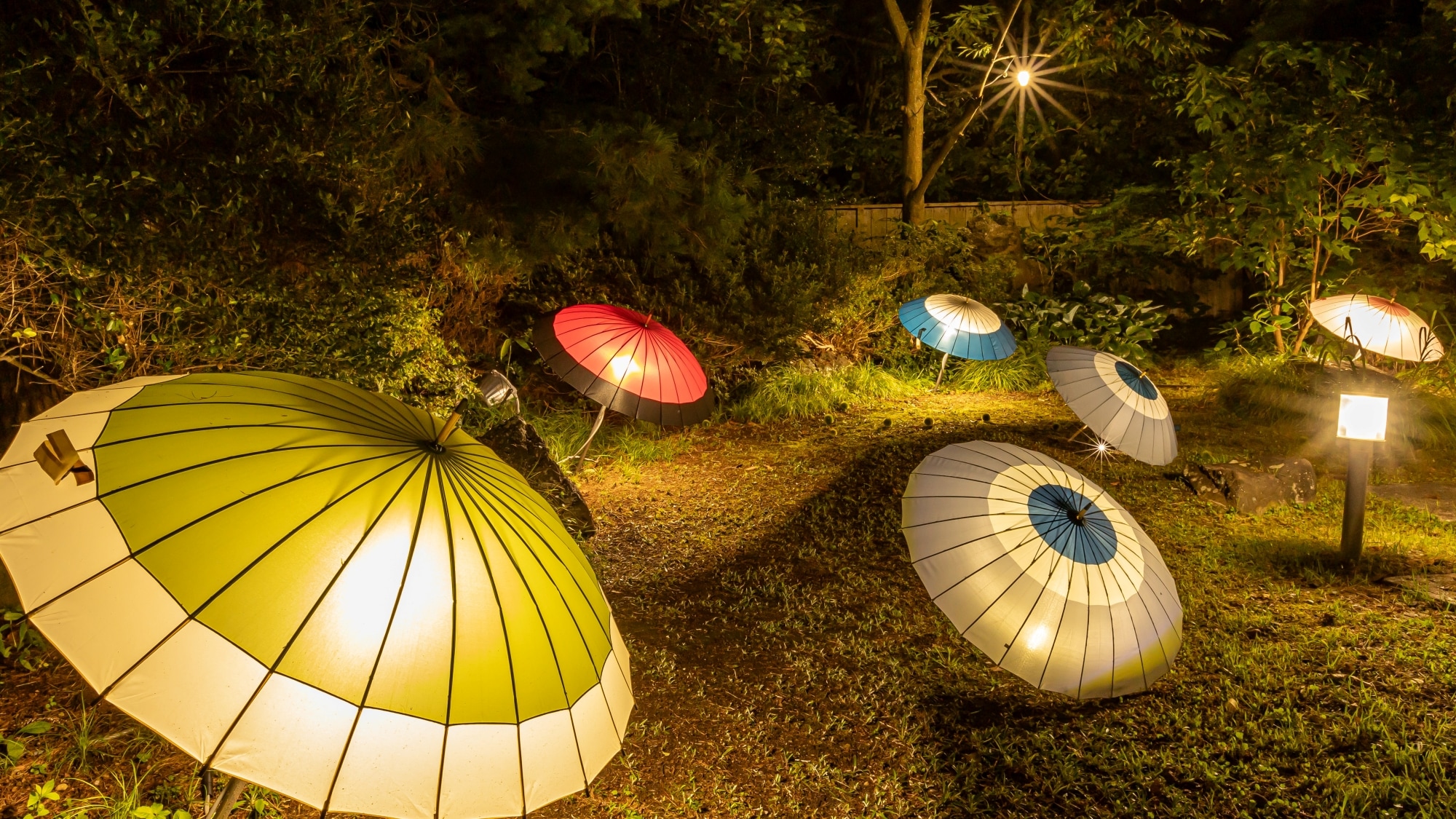 Illuminated Japanese umbrellas over the open-air bath (women's bath)