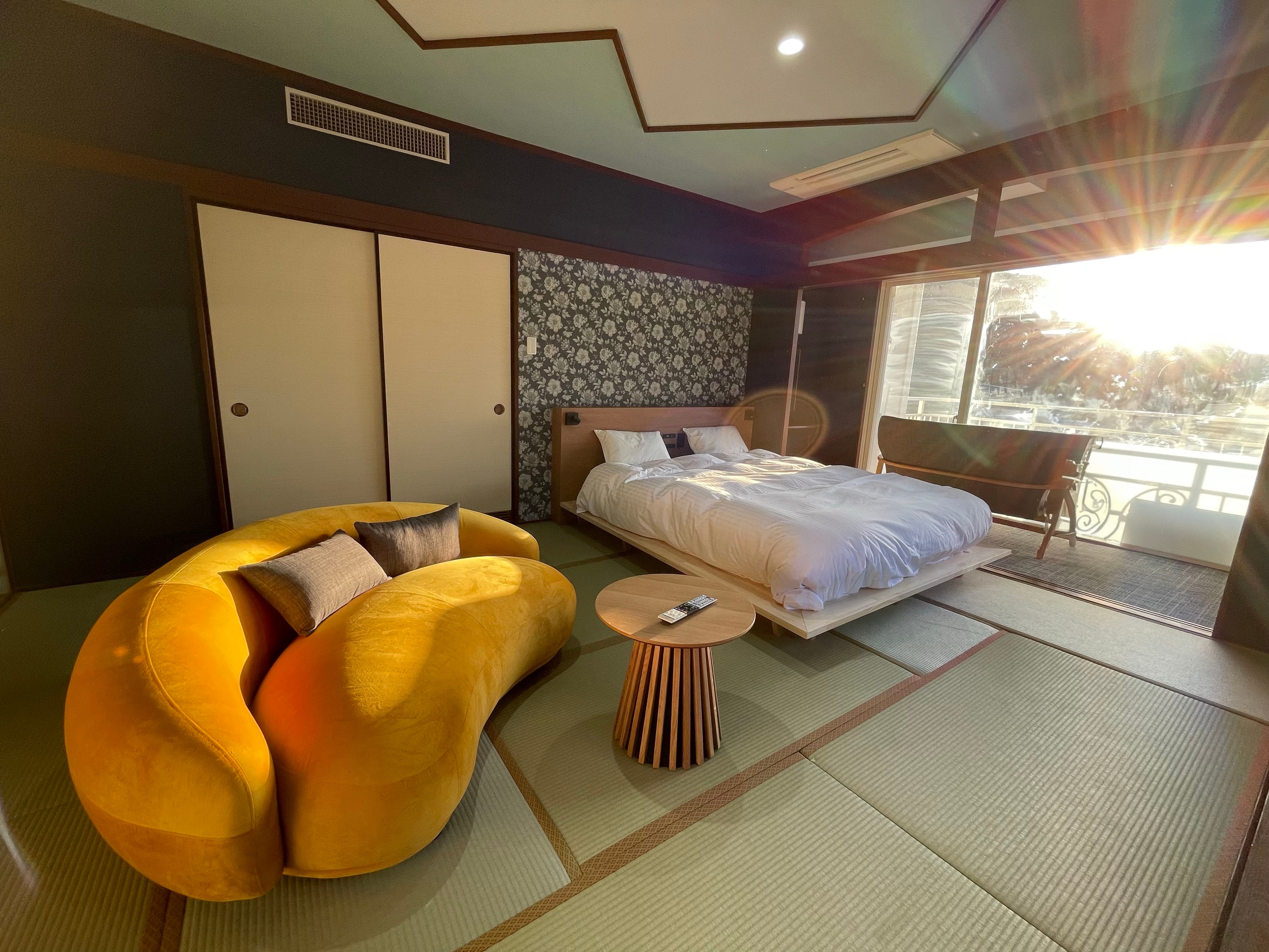 Hot Spring Town Queen Room: 12 tatami mats + queen bed (46m²) Corner room with great view.