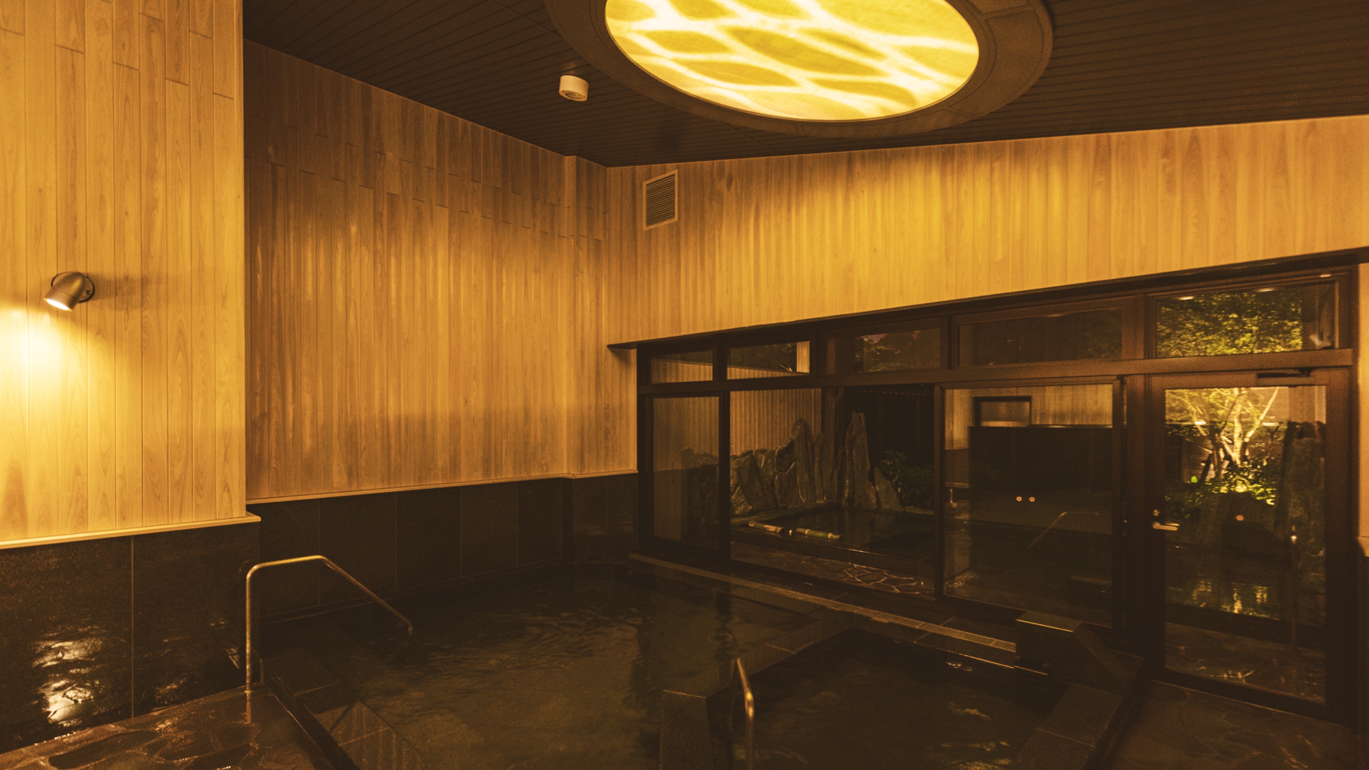 An indoor bath with a full moon theme
