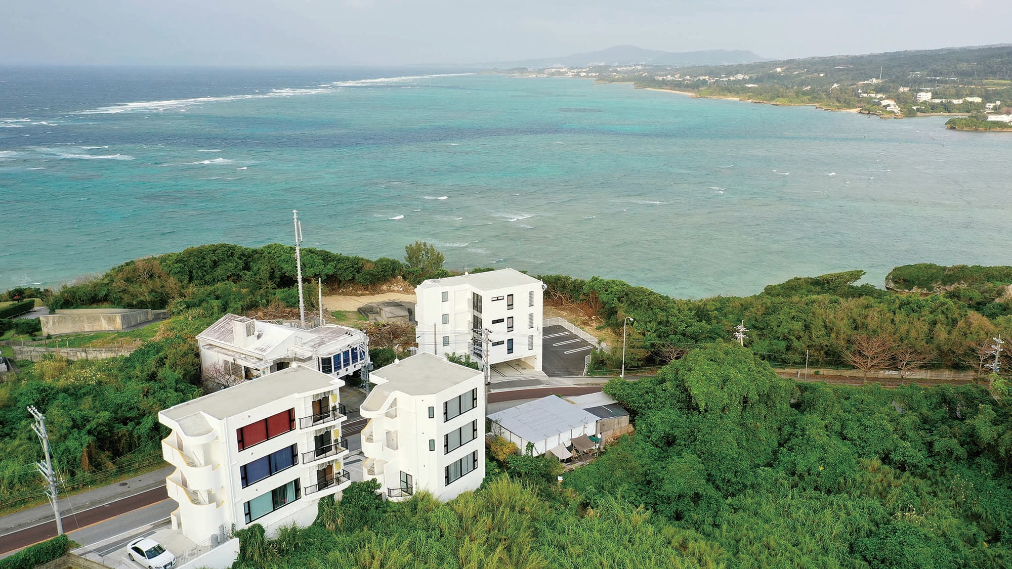 A hotel with a sea near the skyscape.
