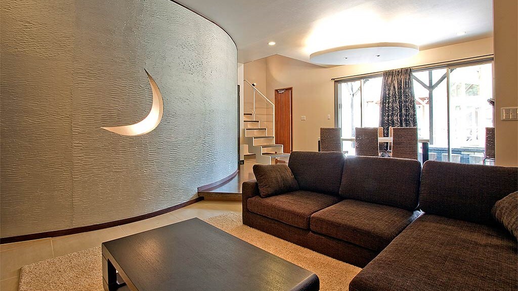 Room 110: Warm light shines through the moon-shaped cut in the wall.