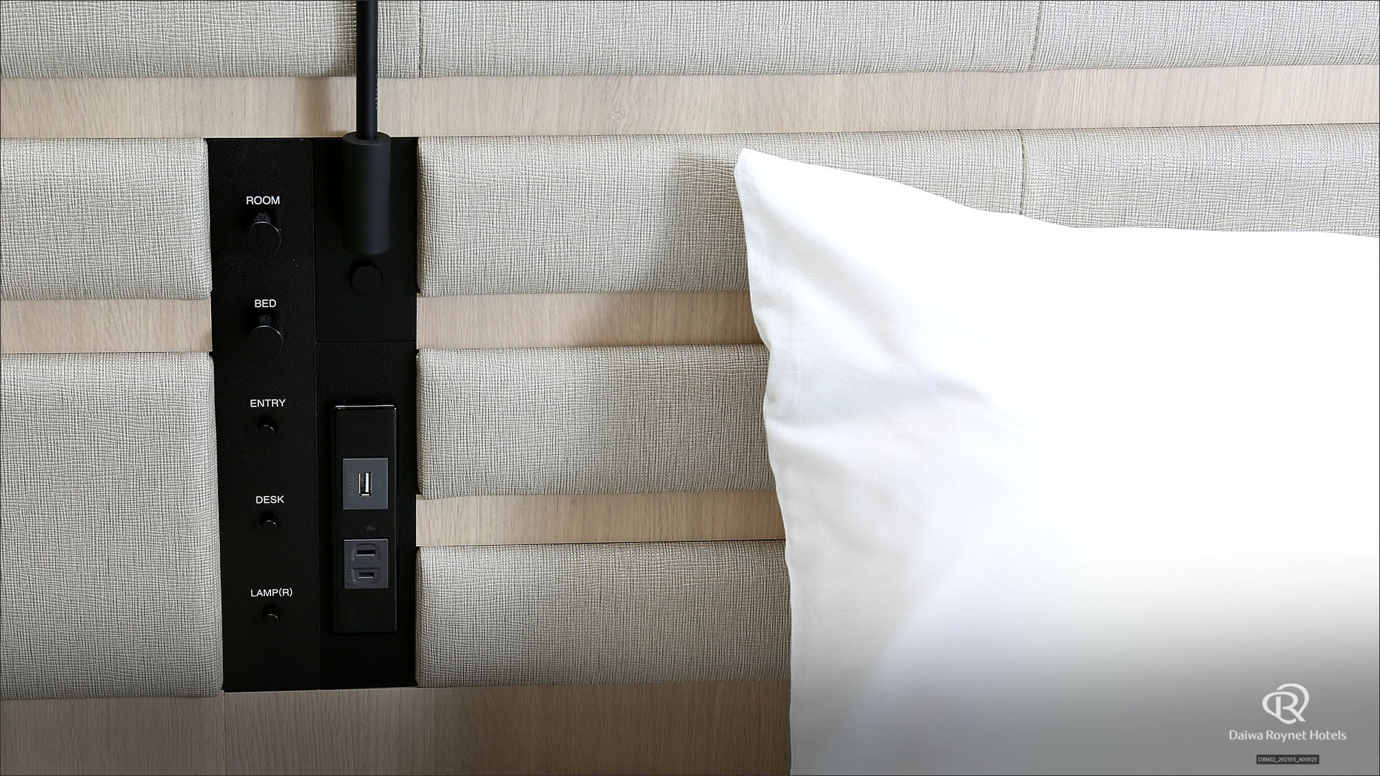 Equipped with an outlet and a USB port next to the bed