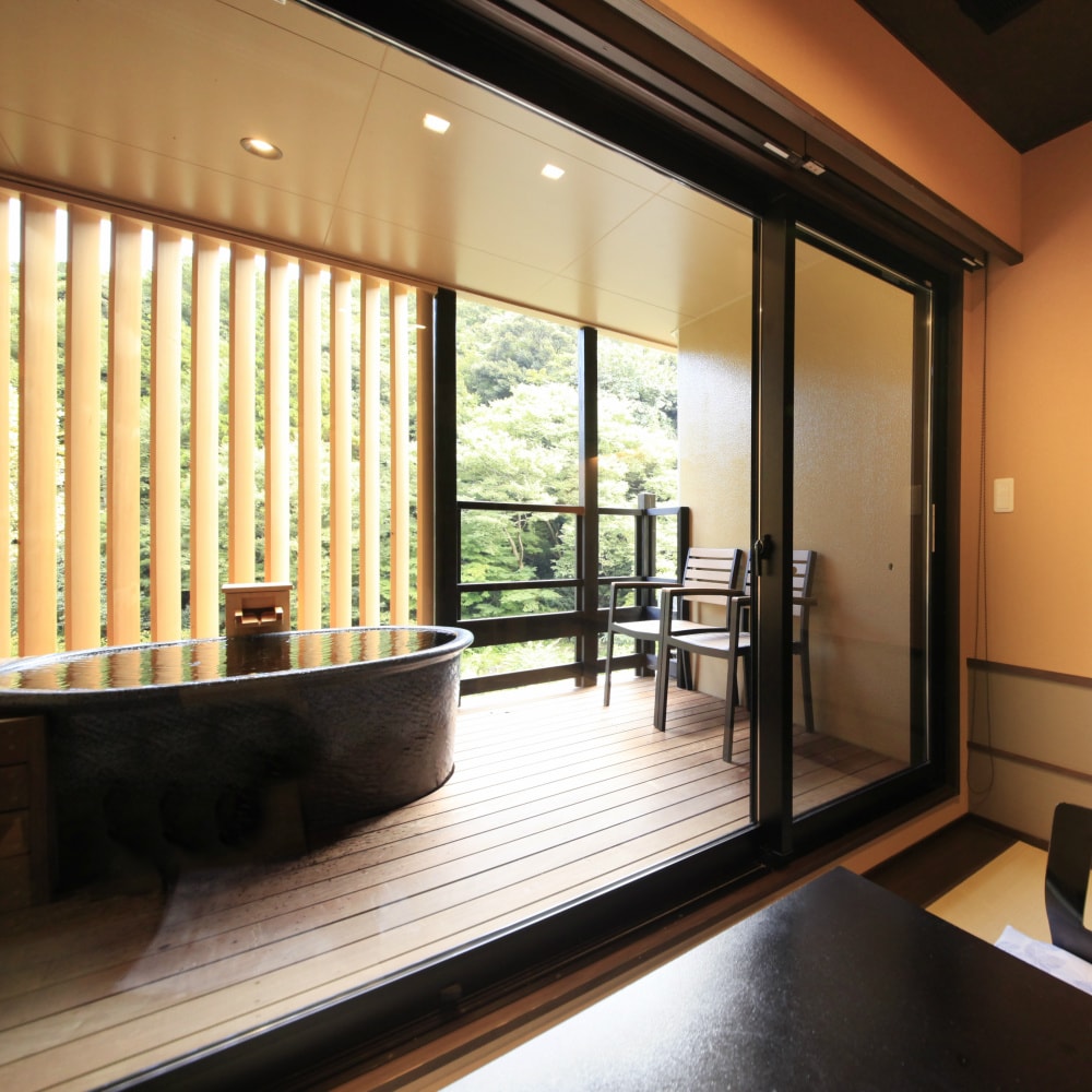 An example of a Japanese-style room with an open-air bath