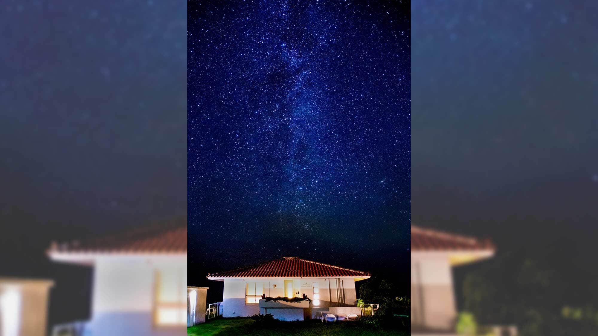 The stars that cover the sky are reflected on the sea, creating a truly fantastical sight.