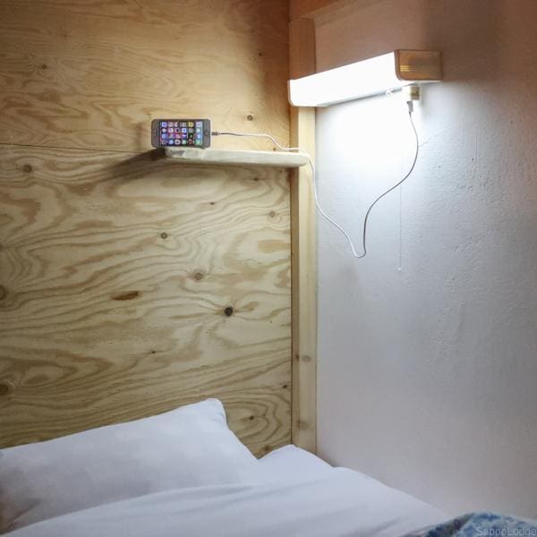 Common to all dormitories. A hand light and an outlet are installed in each bed.