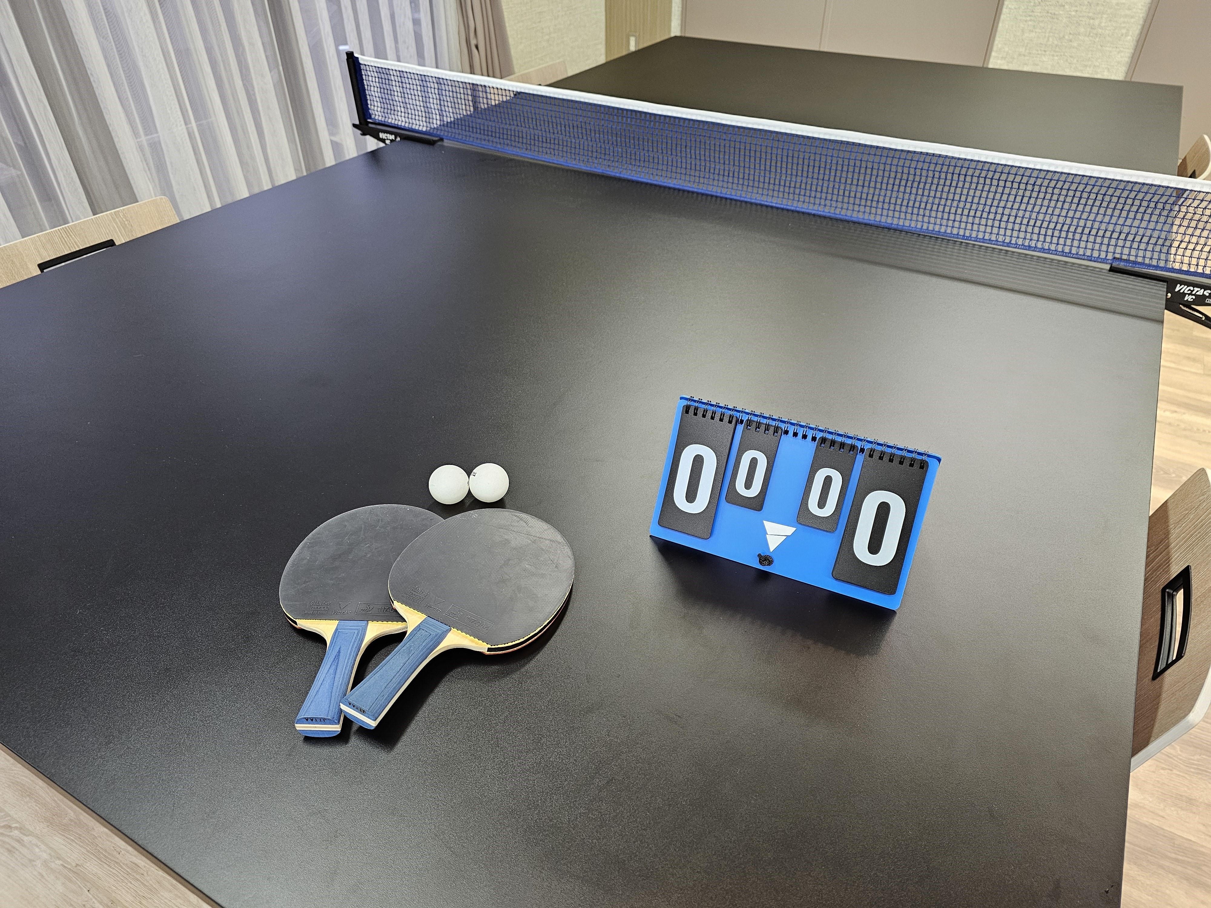 There are two ping pong tables in the annex lobby.